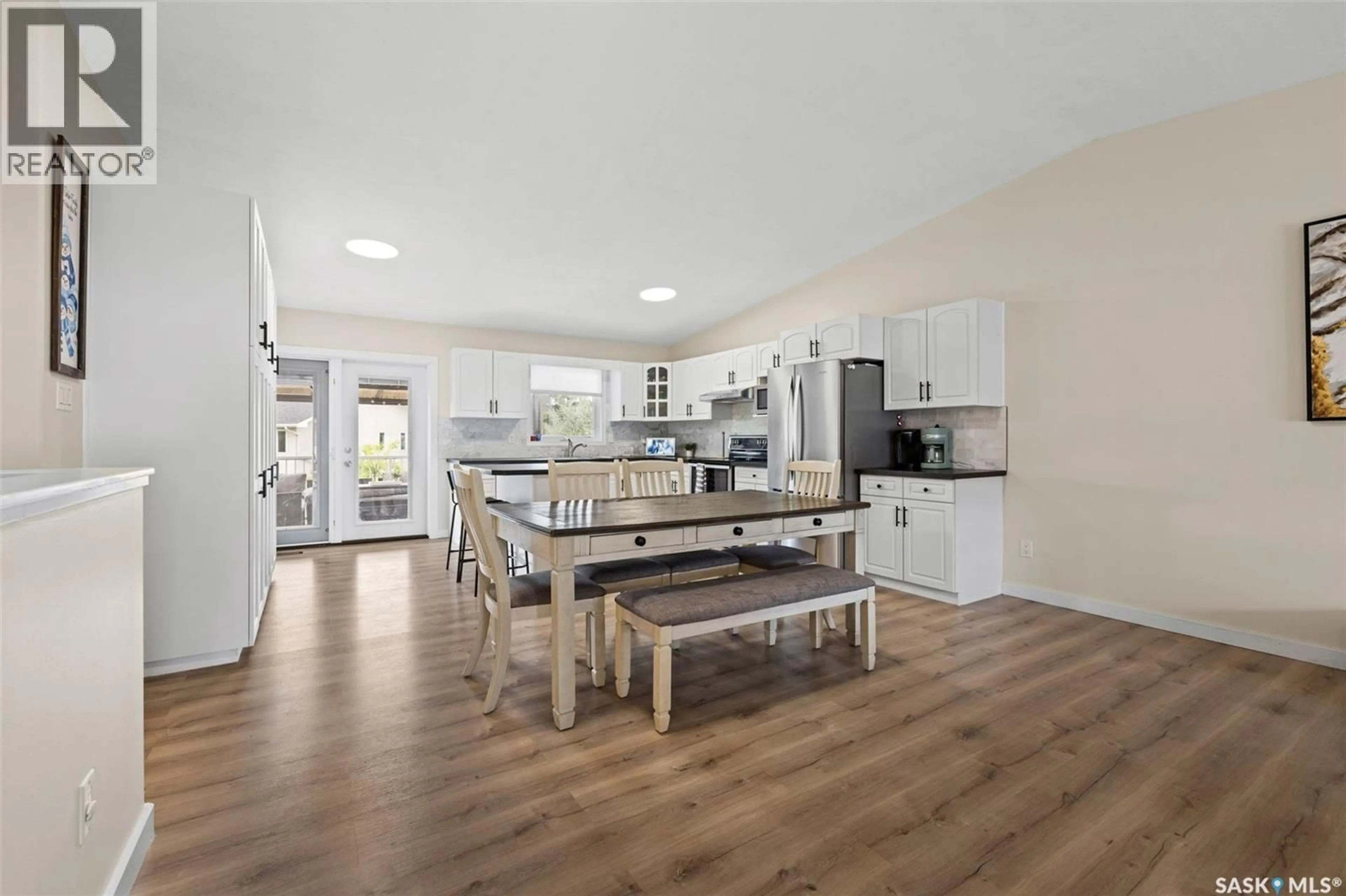Open concept kitchen, wood/laminate floor for 418 HAWKES STREET, Balgonie Saskatchewan S0G0E0
