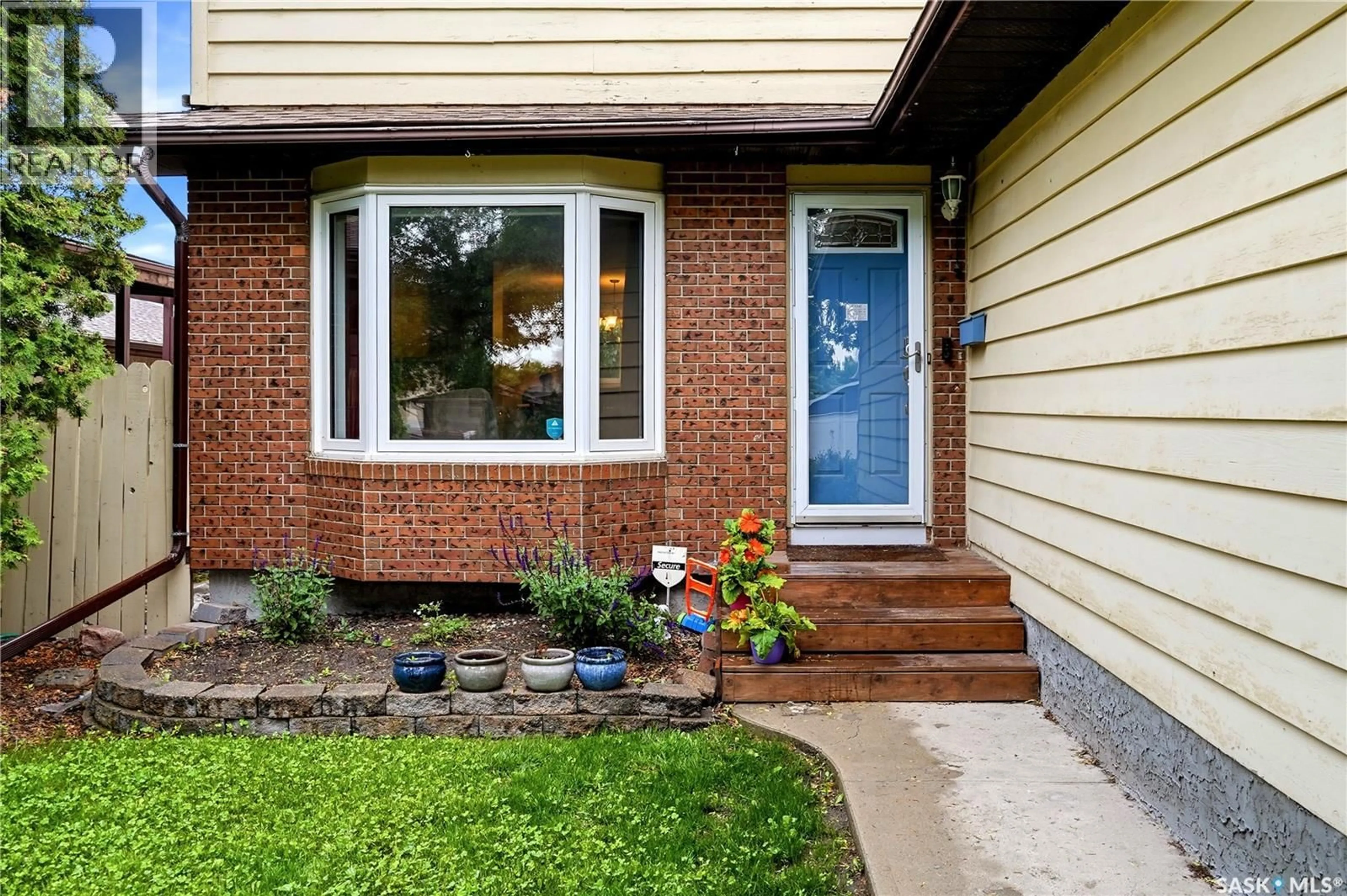Home with brick exterior material, street for 1107 FERGUSON CRESCENT, Regina Saskatchewan S4N6W1