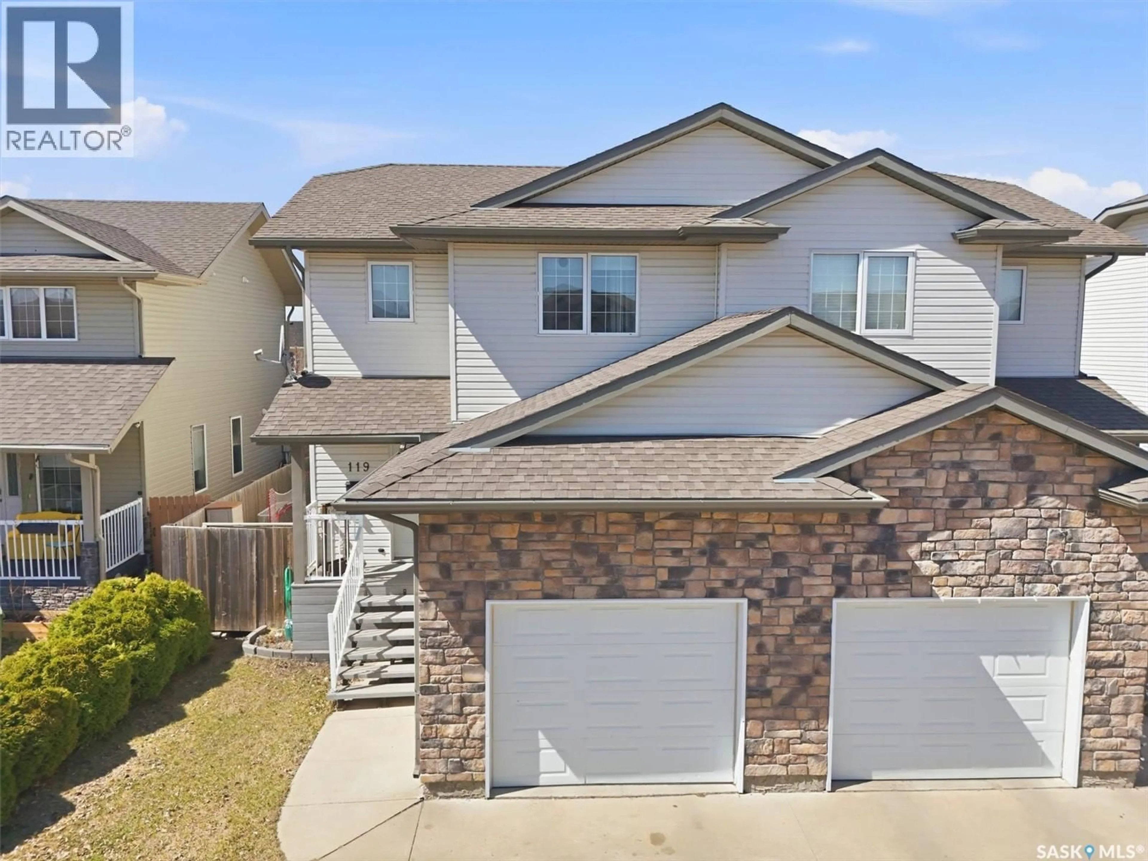 Home with vinyl exterior material, street for 119 MEADOWLARK PARK, Warman Saskatchewan S0K0A1