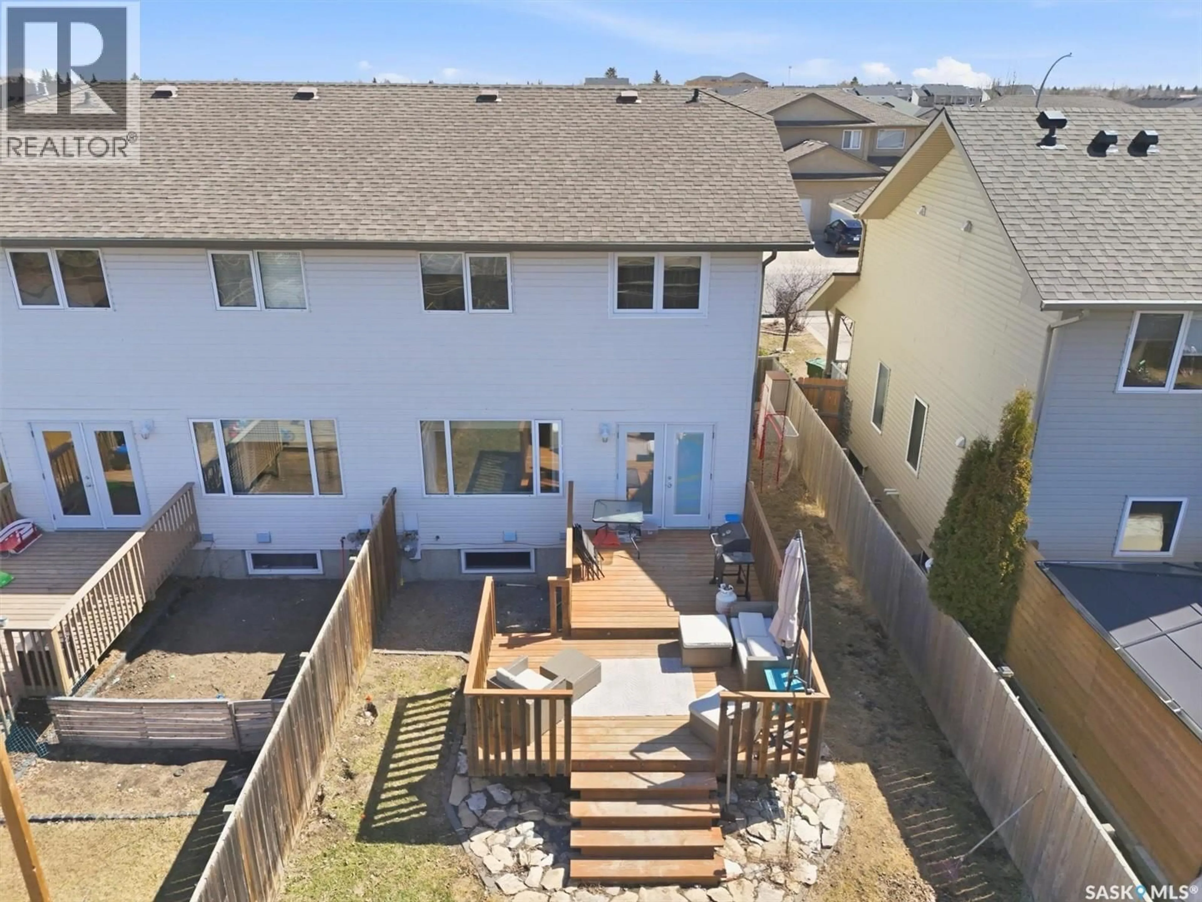 A pic from outside/outdoor area/front of a property/back of a property/a pic from drone, street for 119 MEADOWLARK PARK, Warman Saskatchewan S0K0A1
