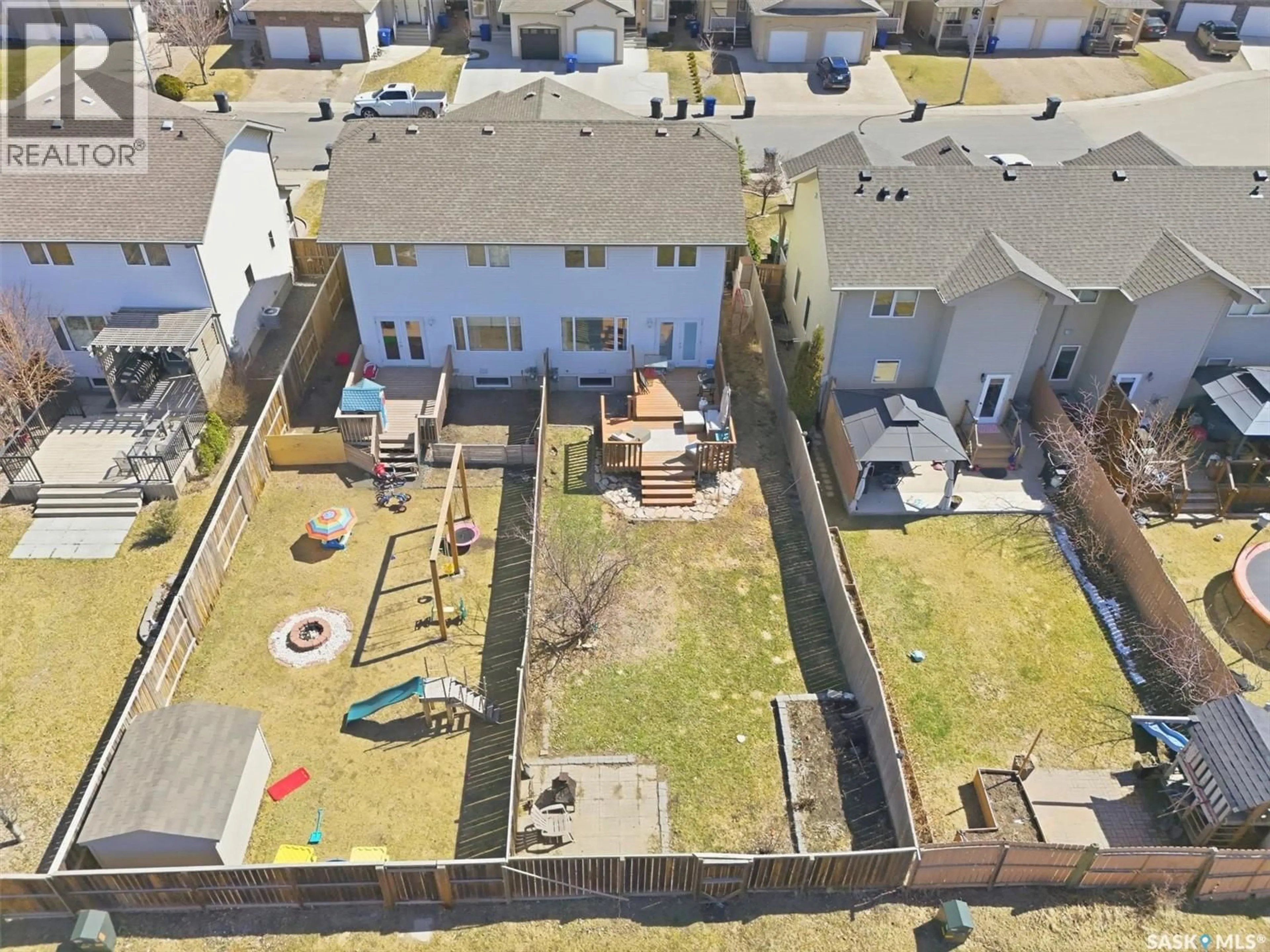 A pic from outside/outdoor area/front of a property/back of a property/a pic from drone, street for 119 MEADOWLARK PARK, Warman Saskatchewan S0K0A1