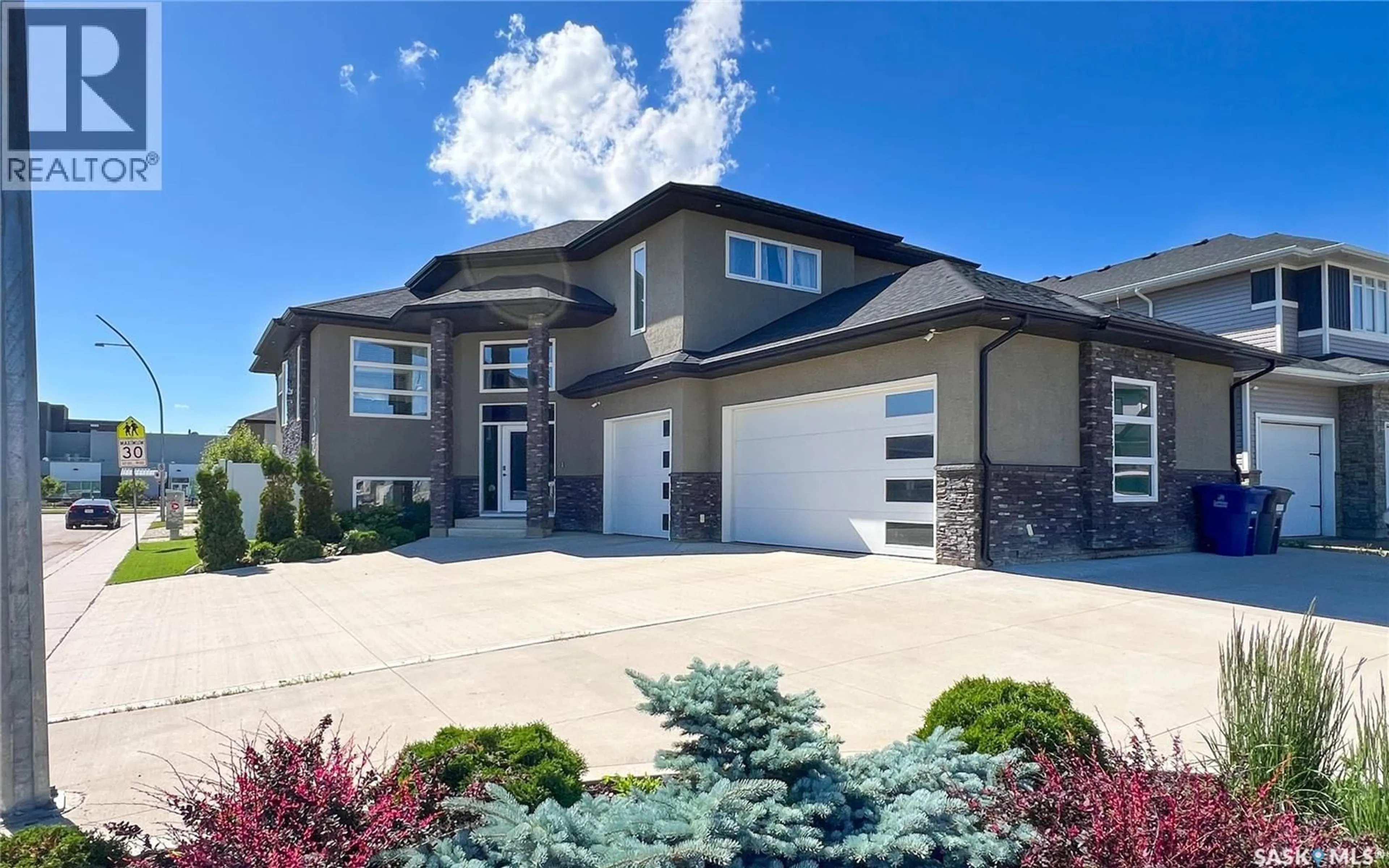 Home with brick exterior material, street for 202 GLACIAL SHORES COVE, Saskatoon Saskatchewan S7W0R7