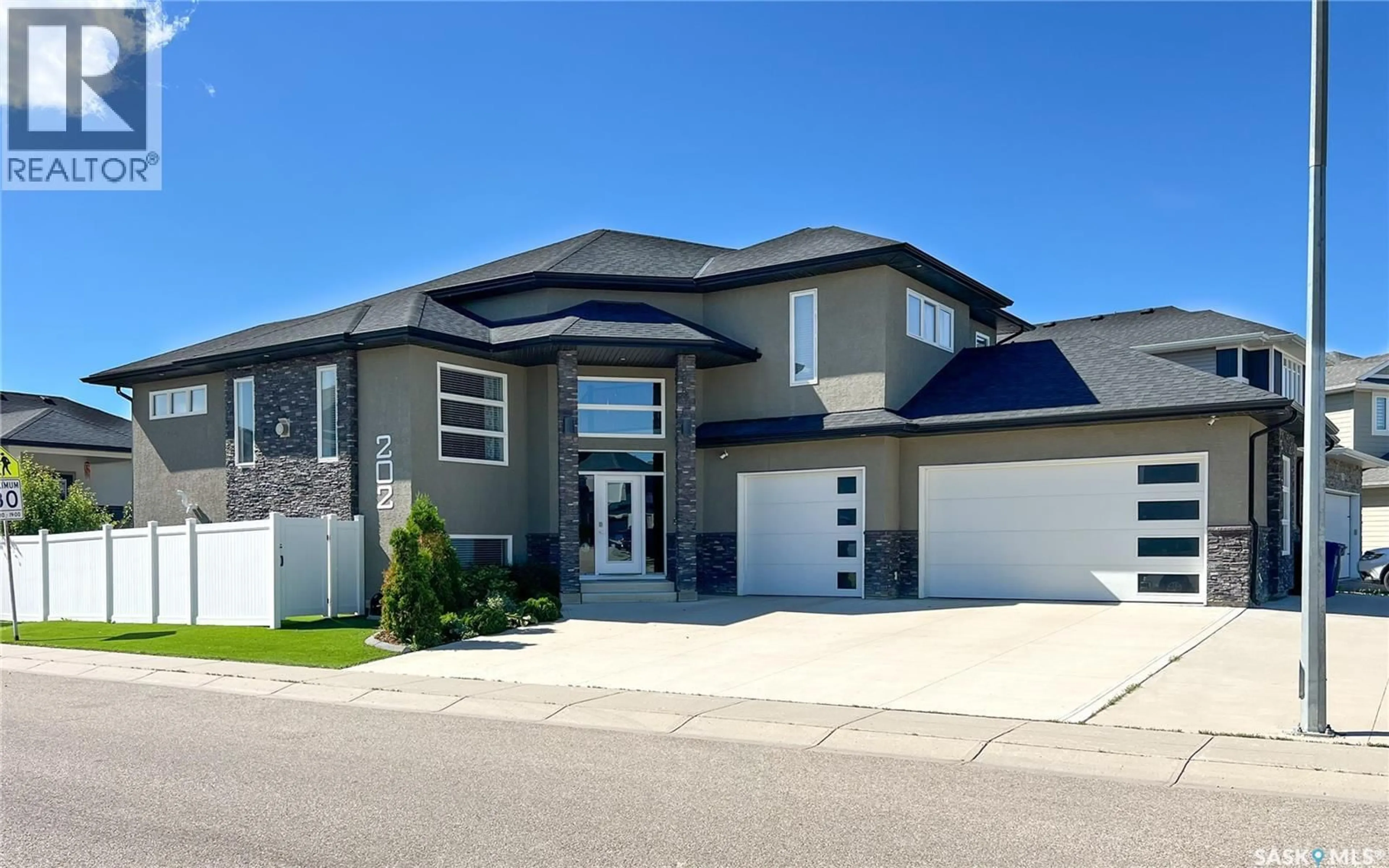Home with vinyl exterior material, street for 202 GLACIAL SHORES COVE, Saskatoon Saskatchewan S7W0R7