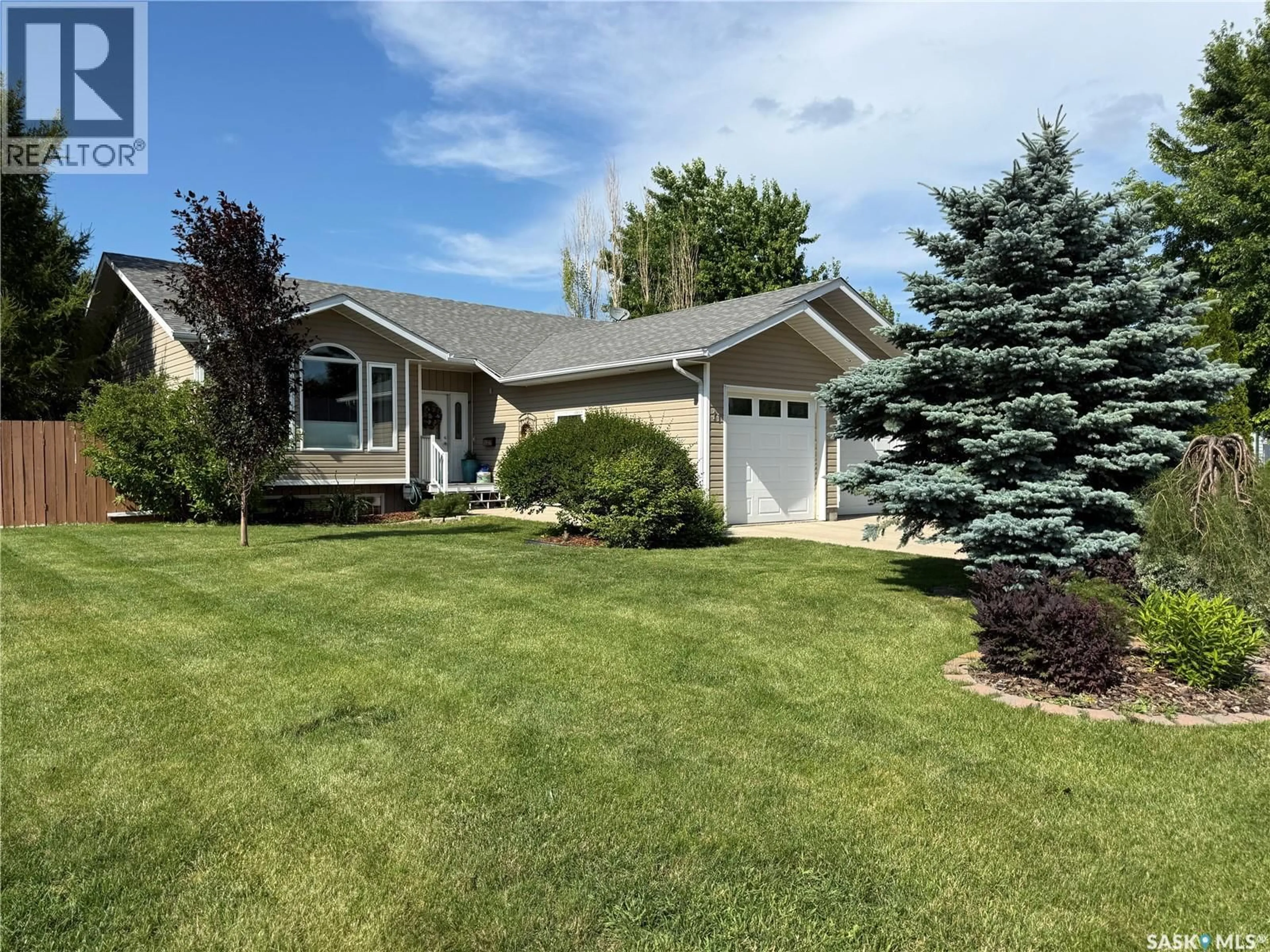 Home with vinyl exterior material, street for 11 REID CRESCENT, Outlook Saskatchewan S0L2N0