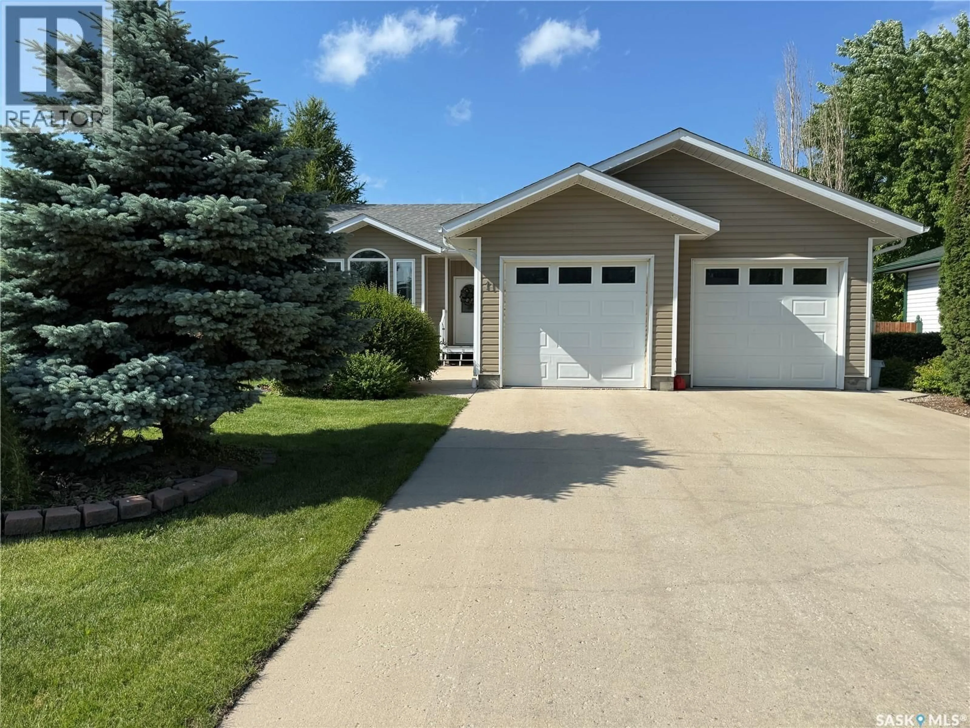 Home with vinyl exterior material, street for 11 REID CRESCENT, Outlook Saskatchewan S0L2N0