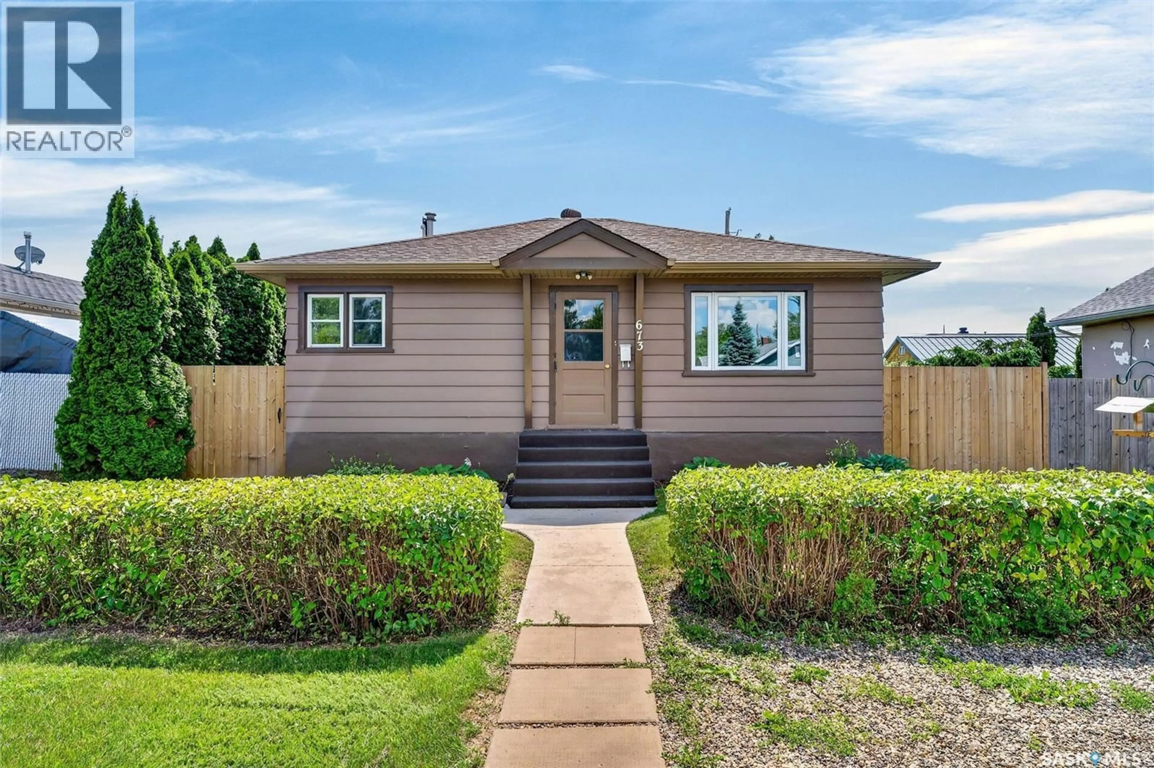 Home with vinyl exterior material, street for 673 8TH STREET, Prince Albert Saskatchewan S6V0W8