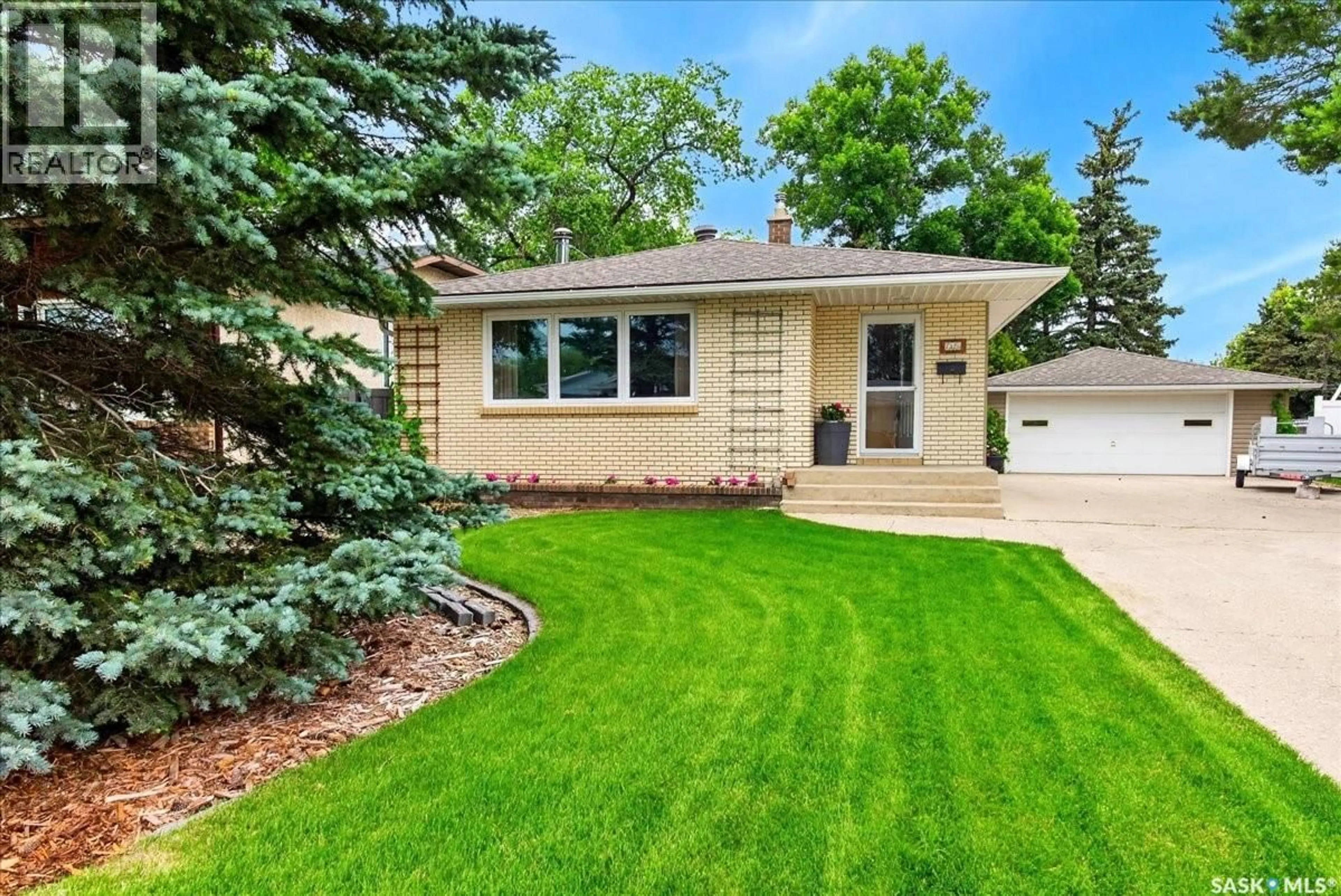 Home with vinyl exterior material, street for 7320 7TH AVENUE, Regina Saskatchewan S4T0T1