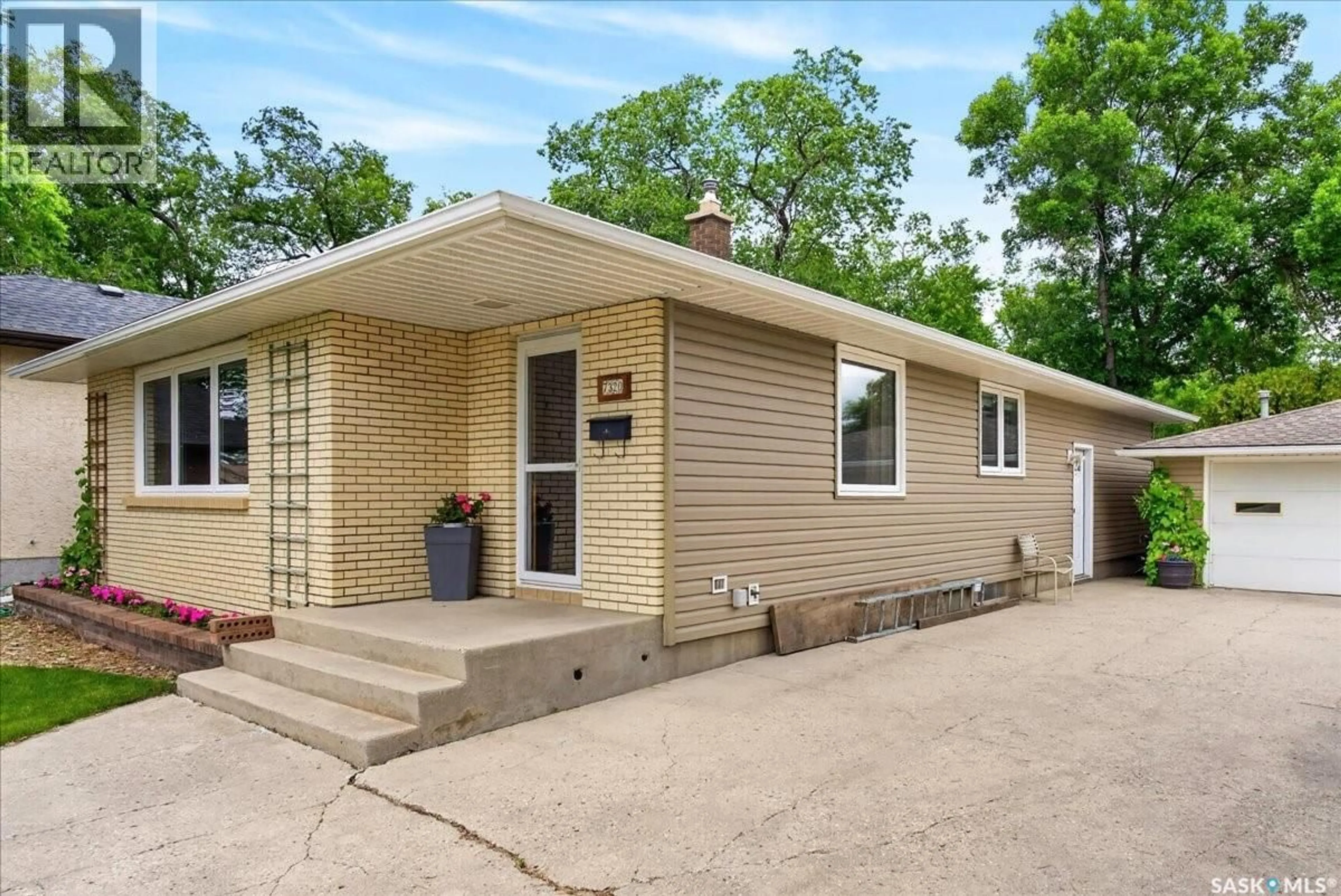 Home with vinyl exterior material, street for 7320 7TH AVENUE, Regina Saskatchewan S4T0T1