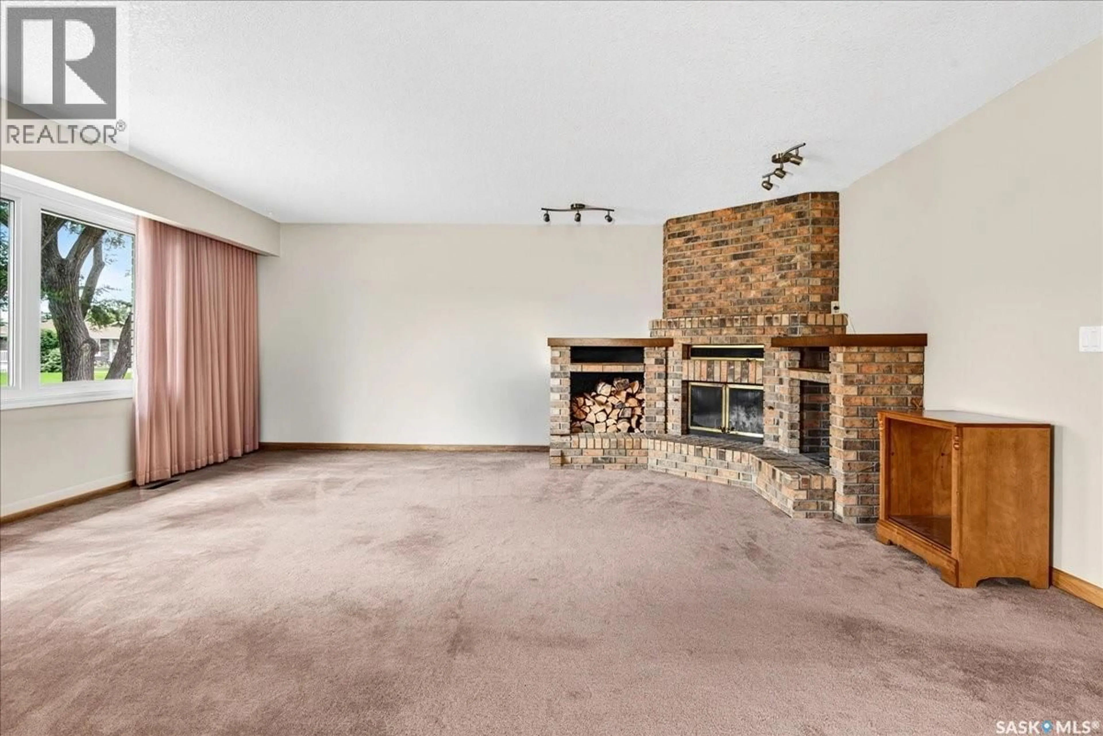 Living room with furniture, carpet floor for 7320 7TH AVENUE, Regina Saskatchewan S4T0T1