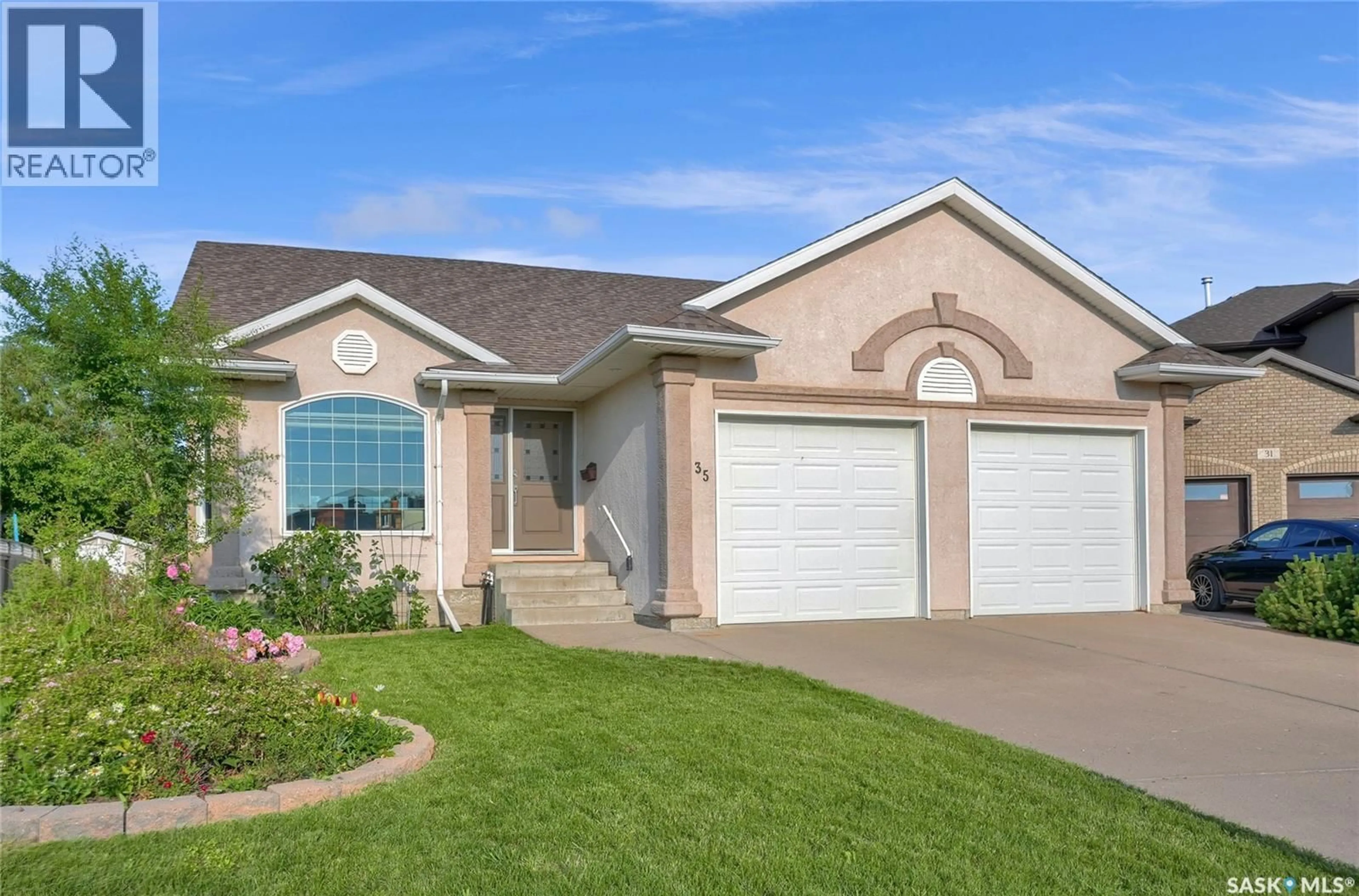 Home with vinyl exterior material, street for 35 MARIGOLD CRESCENT, Moose Jaw Saskatchewan S6J1L2