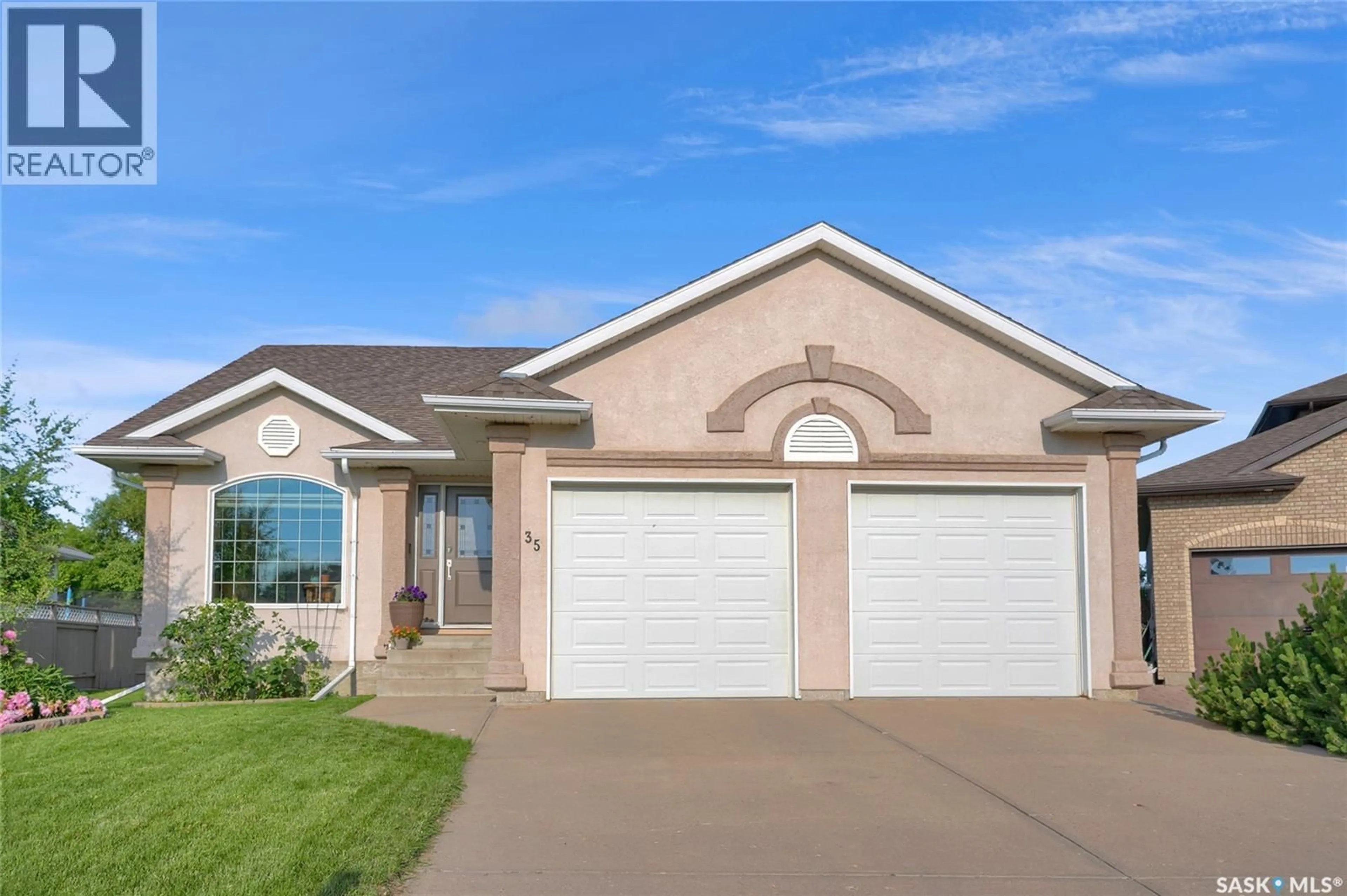 Home with vinyl exterior material, street for 35 MARIGOLD CRESCENT, Moose Jaw Saskatchewan S6J1L2