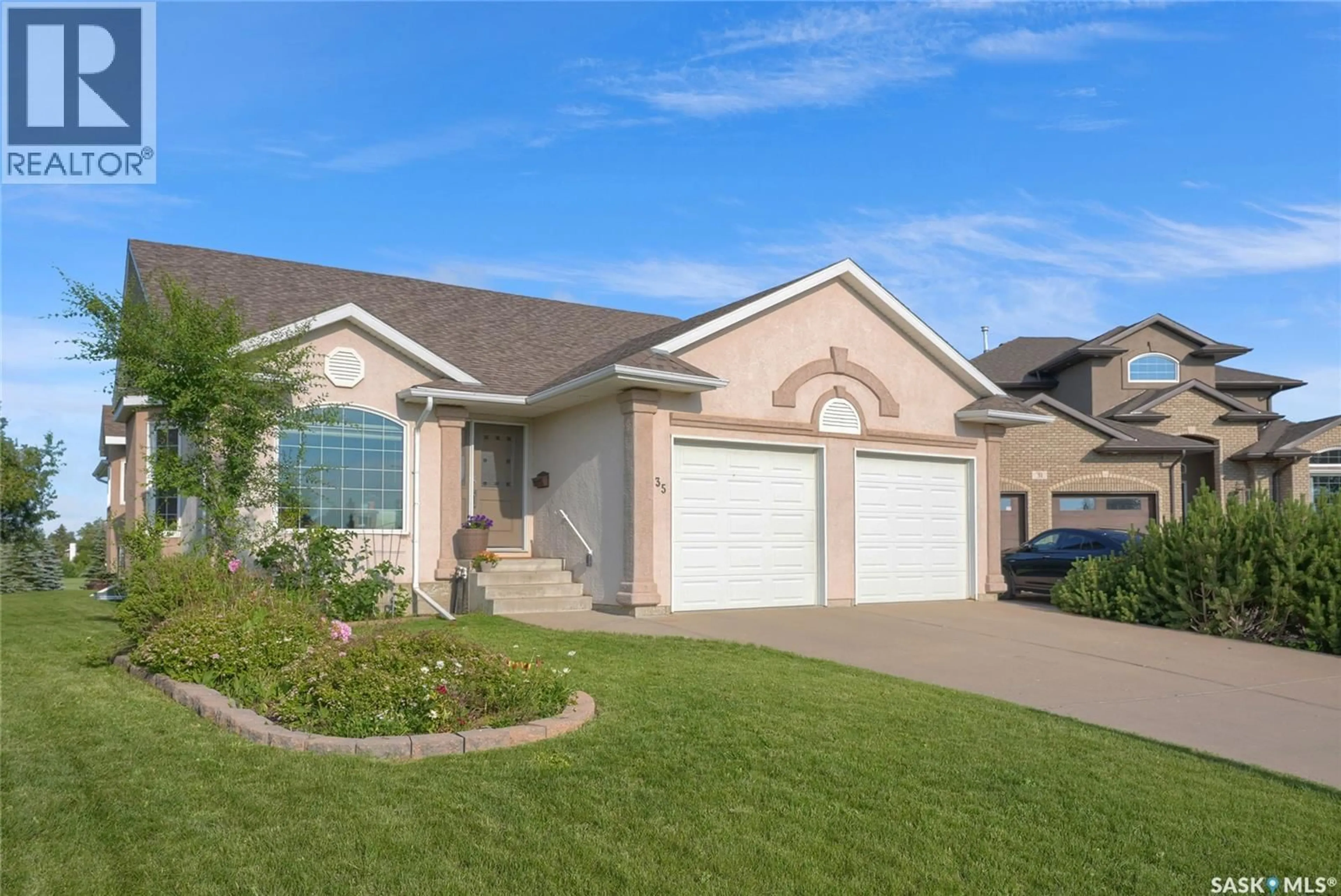 Home with vinyl exterior material, street for 35 MARIGOLD CRESCENT, Moose Jaw Saskatchewan S6J1L2