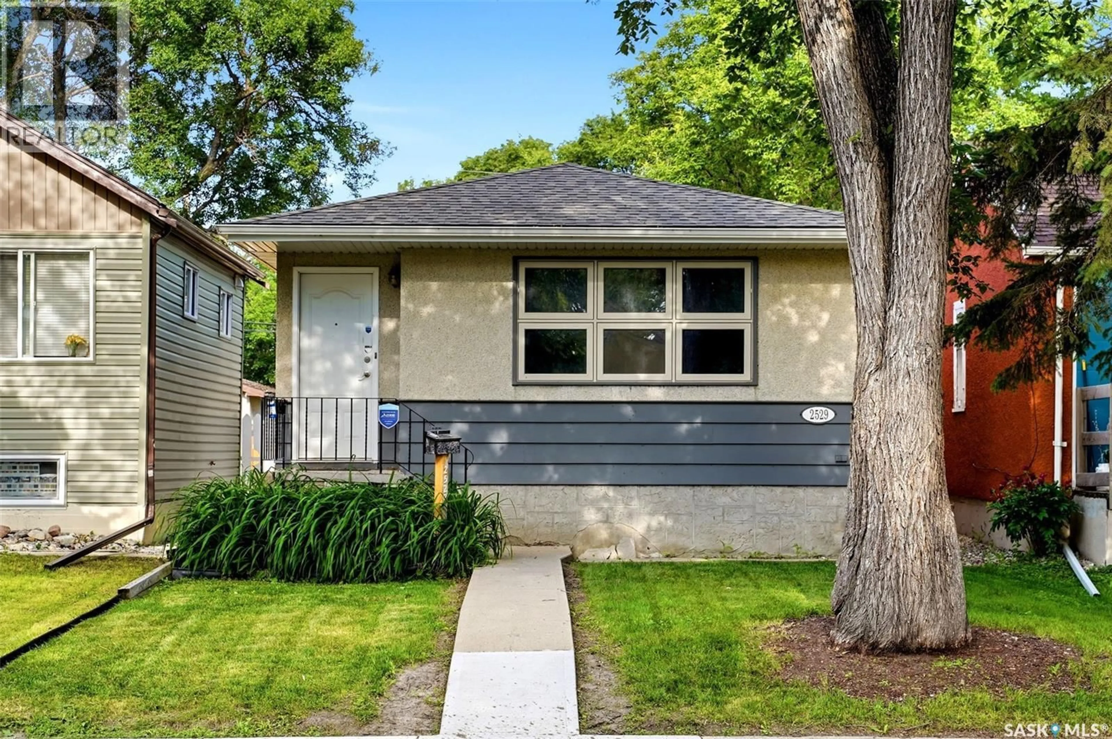 Home with vinyl exterior material, street for 2529 ATKINSON STREET, Regina Saskatchewan S4W3X8
