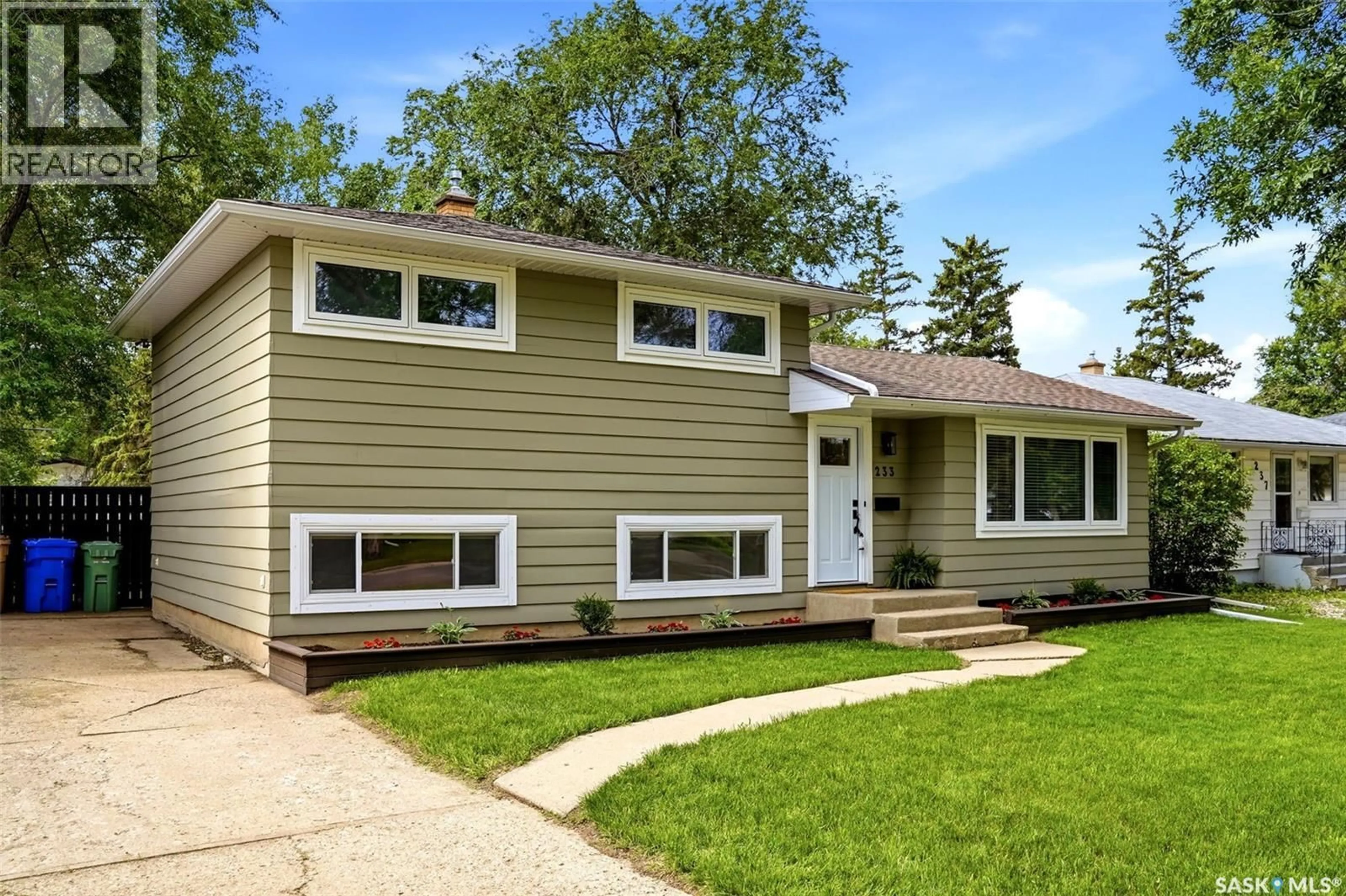 Home with vinyl exterior material, street for 233 ORCHARD CRESCENT, Regina Saskatchewan S4S5B9
