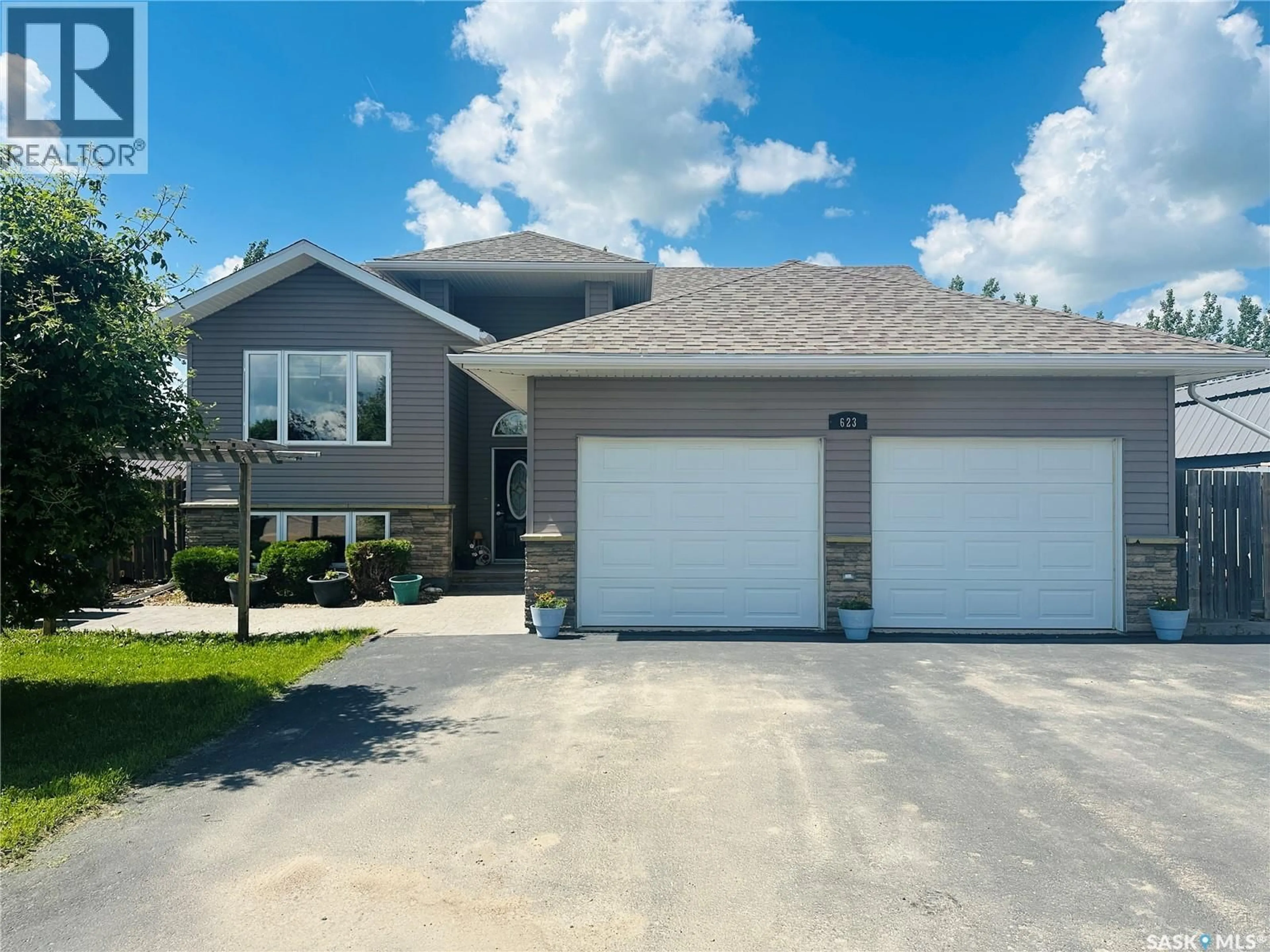 Home with vinyl exterior material, street for 623 FORESTER CRESCENT, Tisdale Saskatchewan S0E1T0