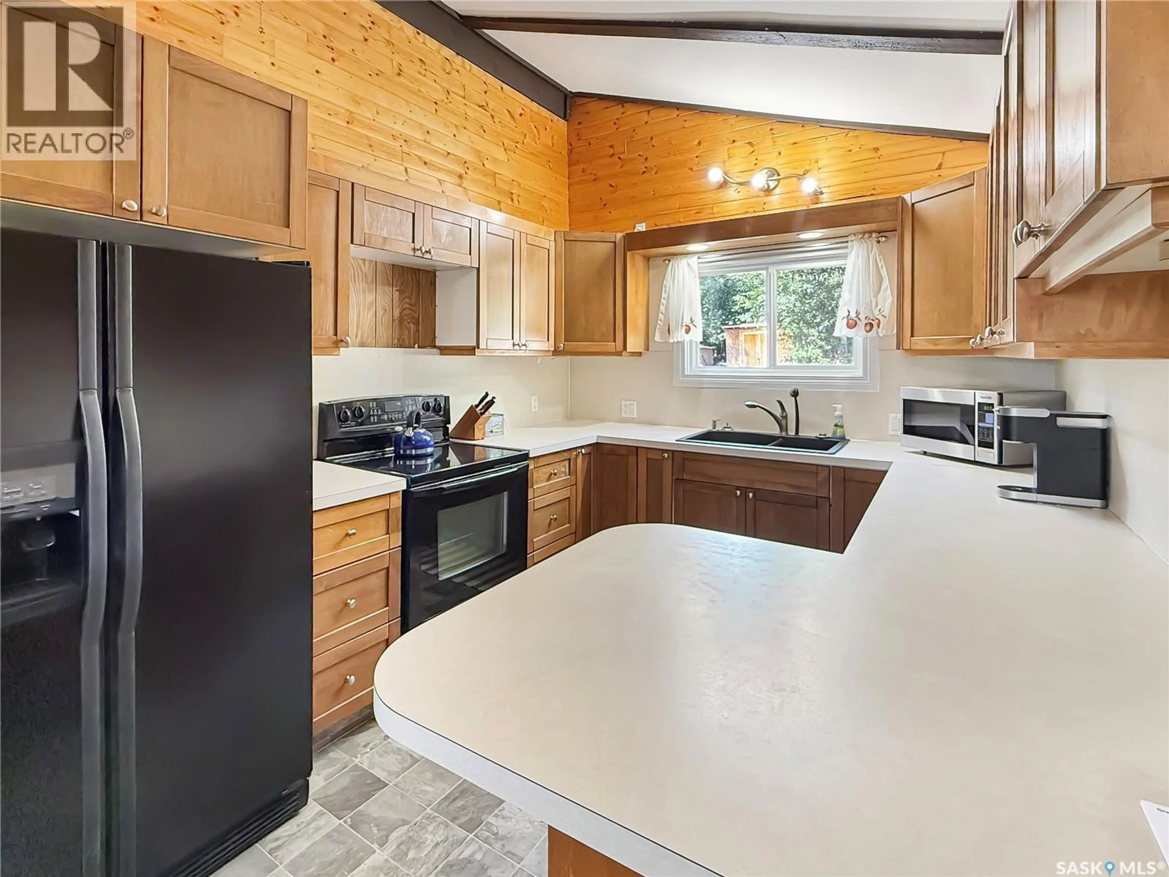 Open concept kitchen, ceramic/tile floor for 34 GADDESBY CRESCENT, Jackfish Lake Saskatchewan S0M0L0