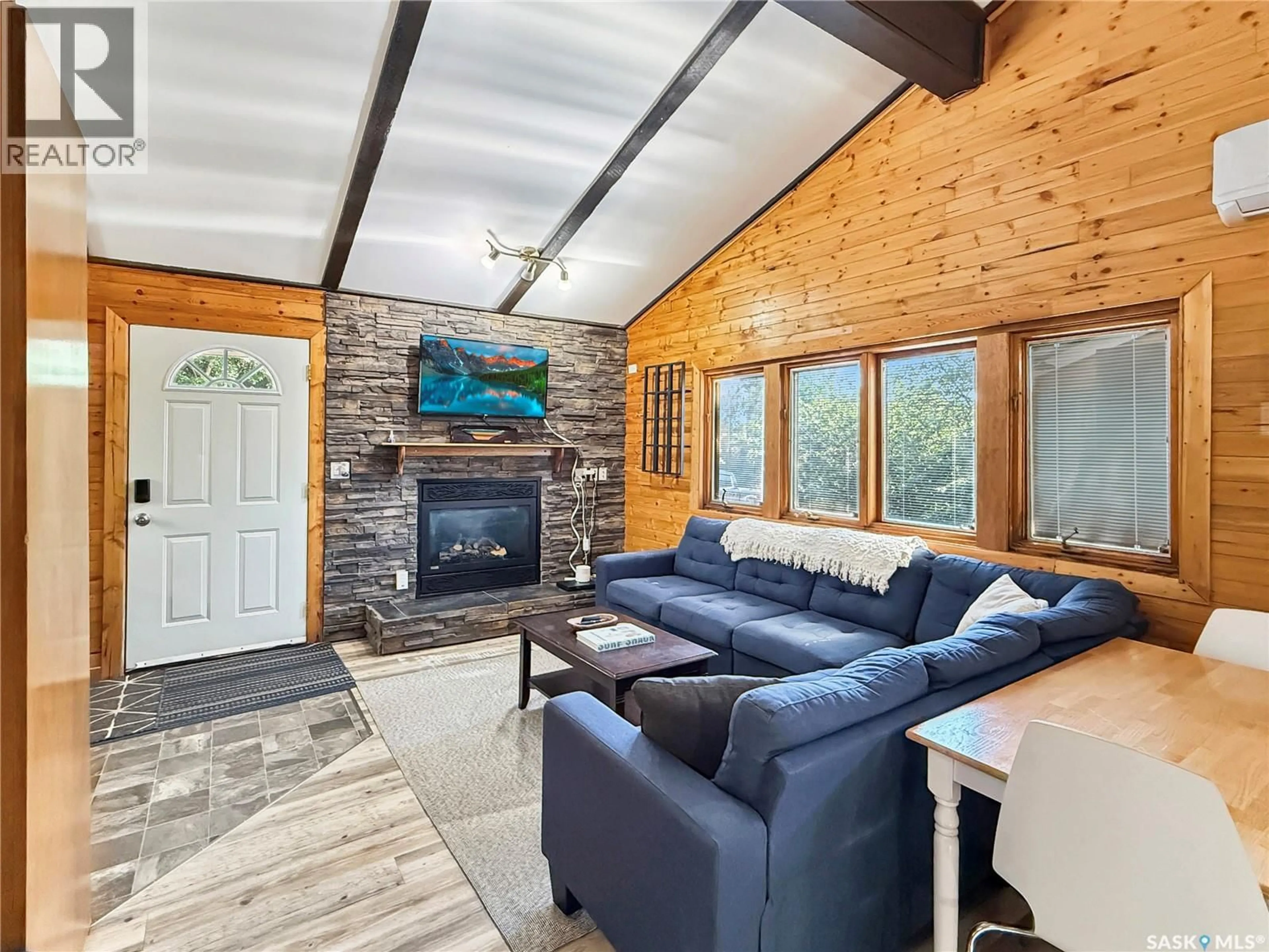 Living room with furniture, wood/laminate floor for 34 GADDESBY CRESCENT, Jackfish Lake Saskatchewan S0M0L0