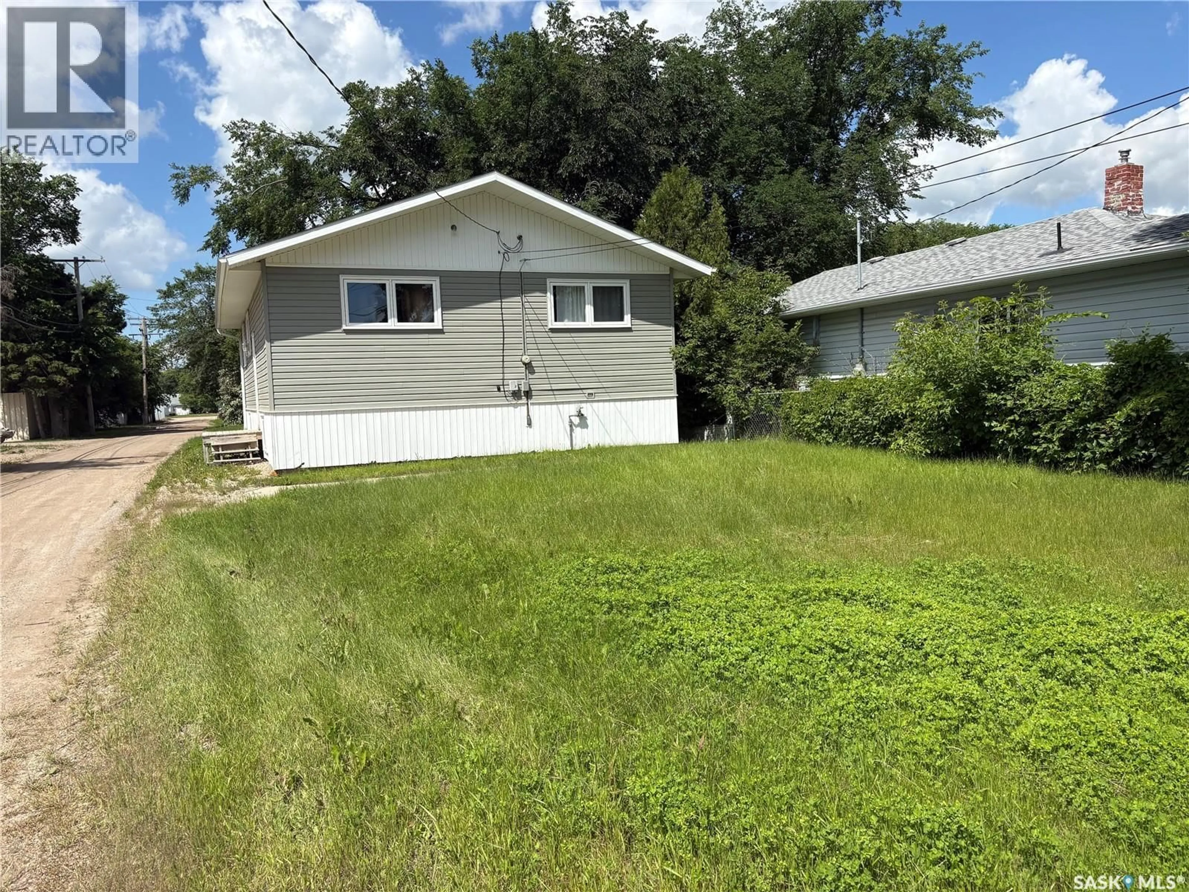 Home with vinyl exterior material, street for 222 1ST STREET, Wadena Saskatchewan S0A4J0