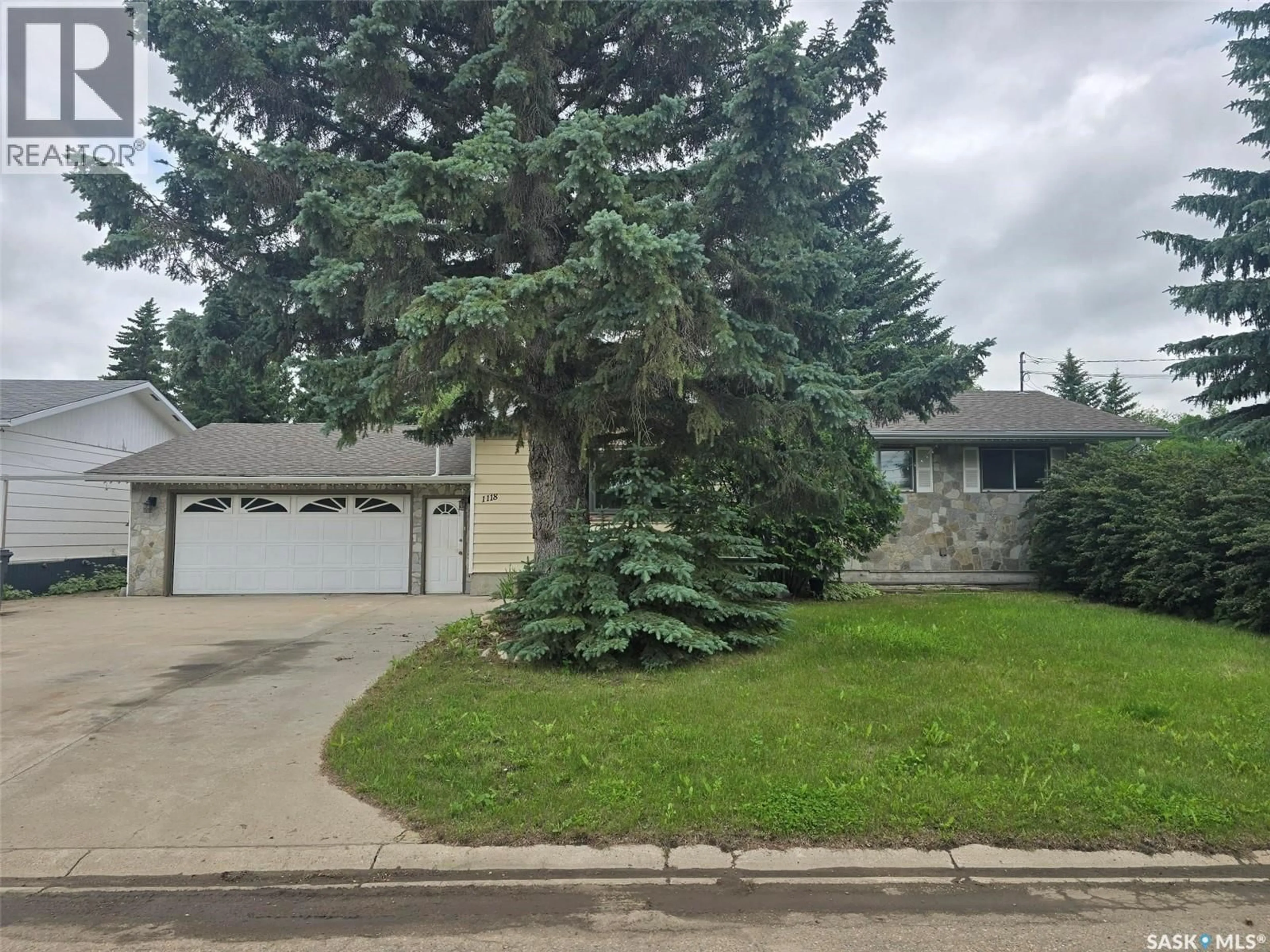 Home with vinyl exterior material, street for 1118 BELL STREET, Indian Head Saskatchewan S0G2K0