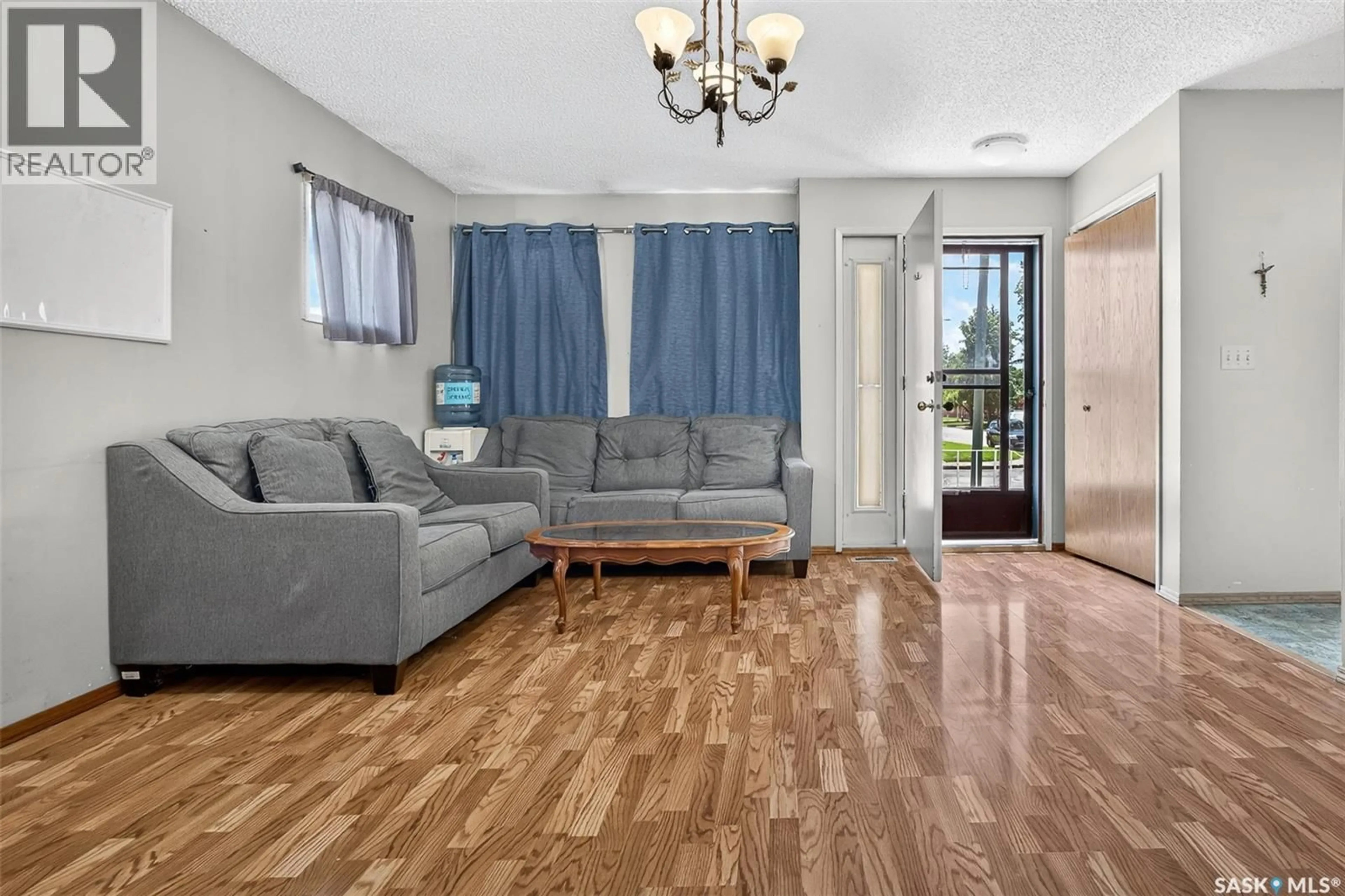 Living room with furniture, wood/laminate floor for 980 BROWN STREET, Moose Jaw Saskatchewan S6H2Z2