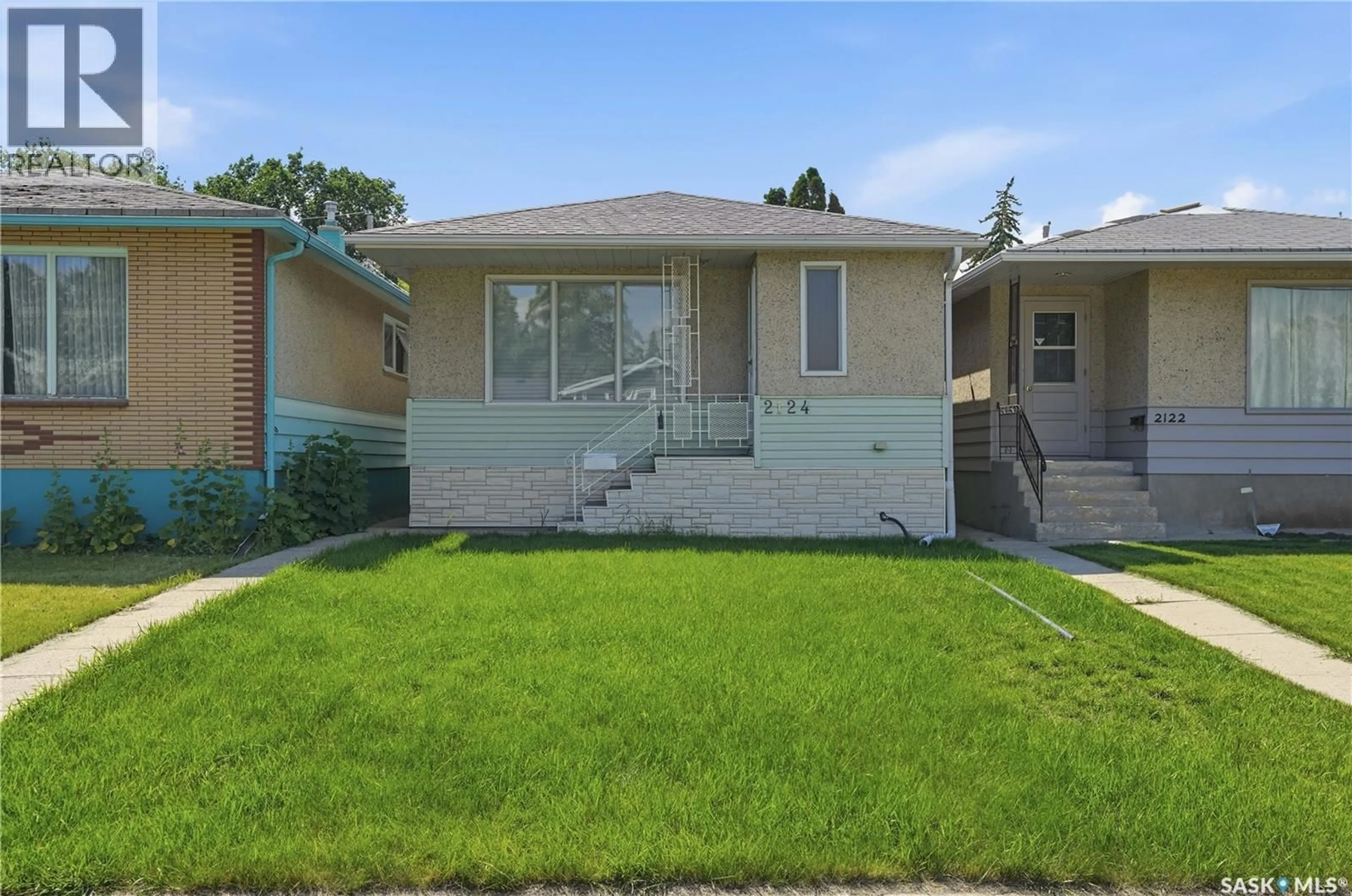 Home with vinyl exterior material, street for 2124 ELLIOTT STREET, Regina Saskatchewan S4N3H2
