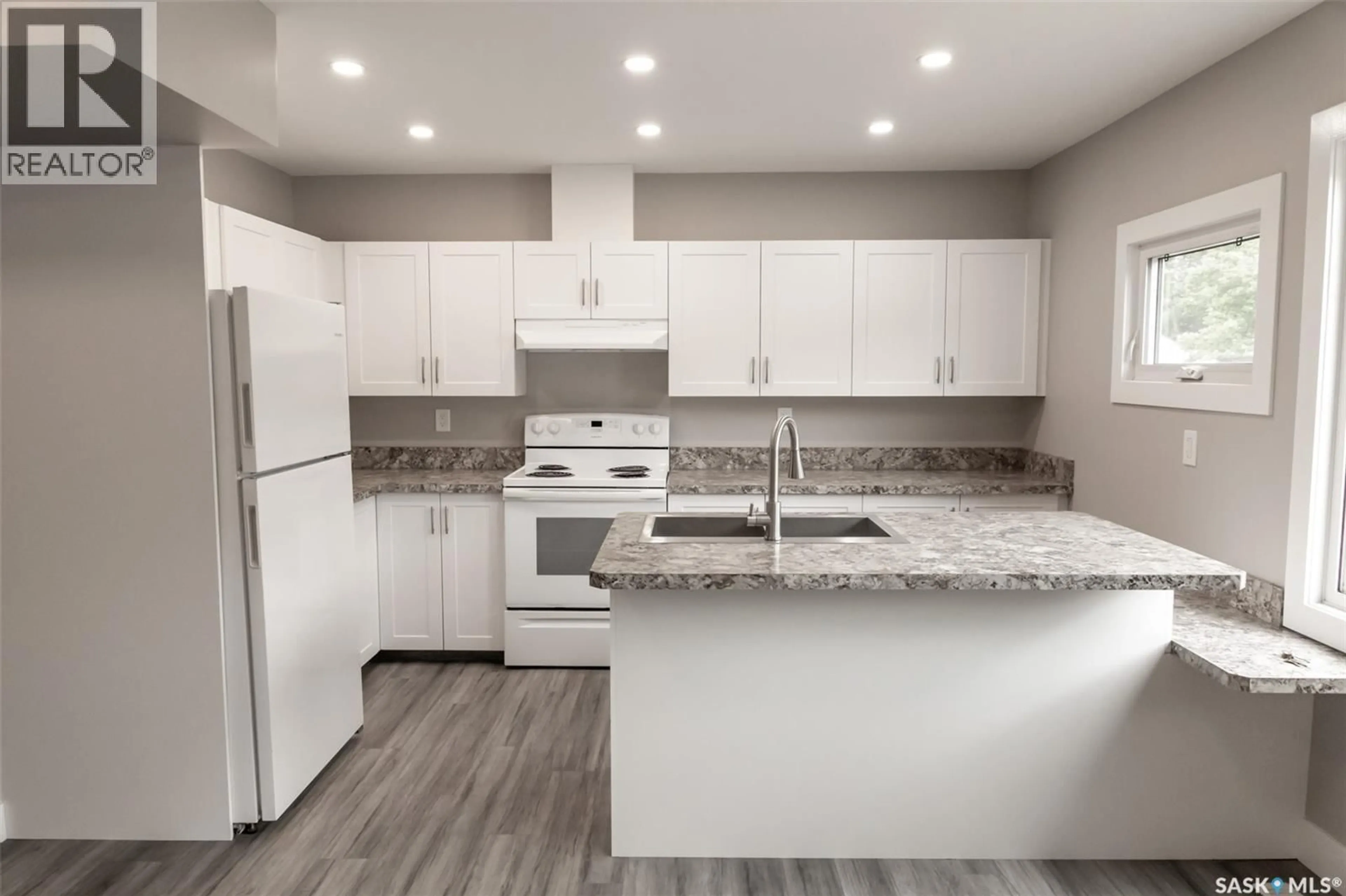 Open concept kitchen, wood/laminate floor for 59 LILLOOET STREET, Moose Jaw Saskatchewan S6H4S3