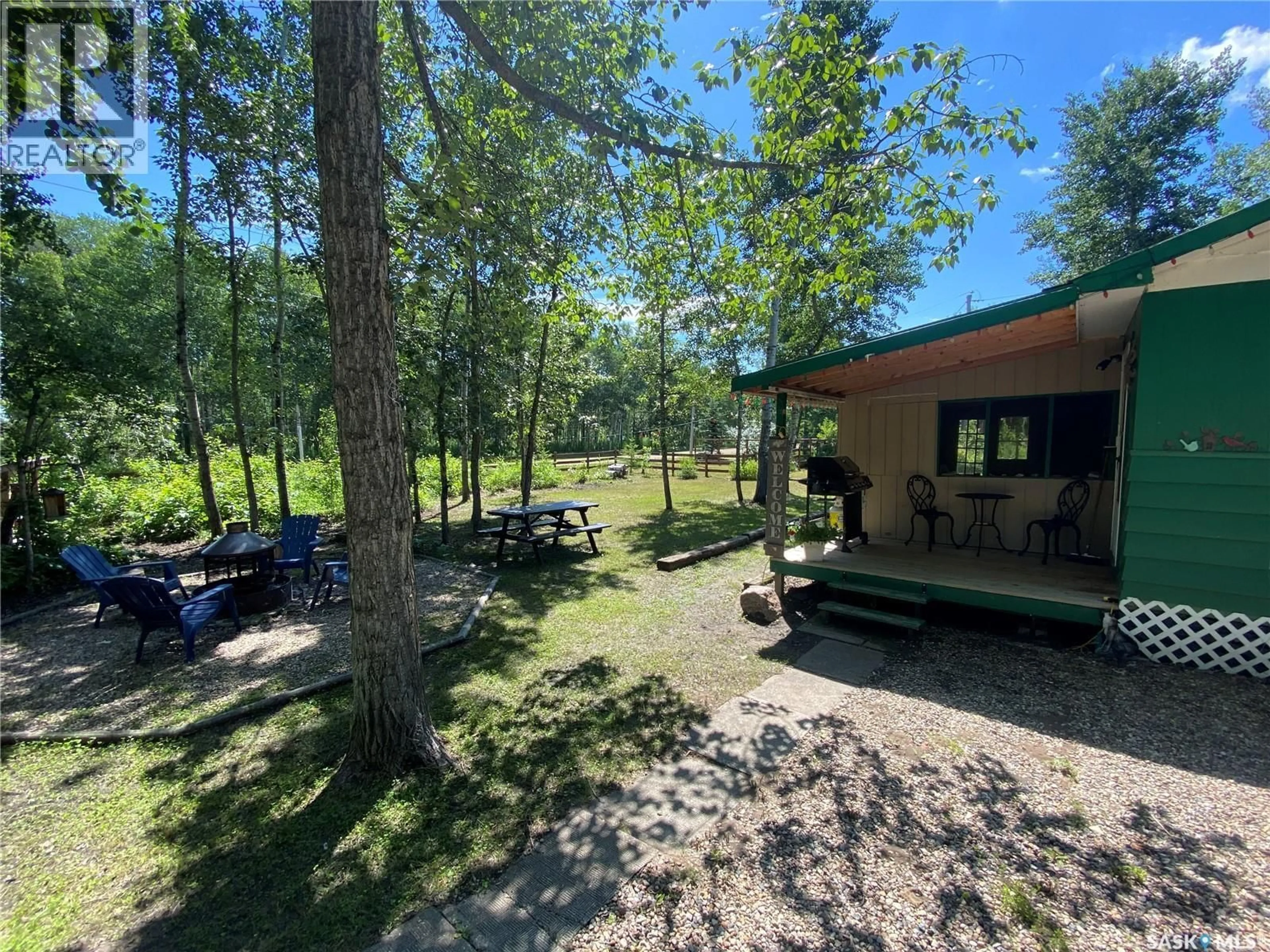A pic from outside/outdoor area/front of a property/back of a property/a pic from drone, forest/trees view for 114-115 GOVERNMENT ROAD, Good Spirit Lake Saskatchewan S0A0L0