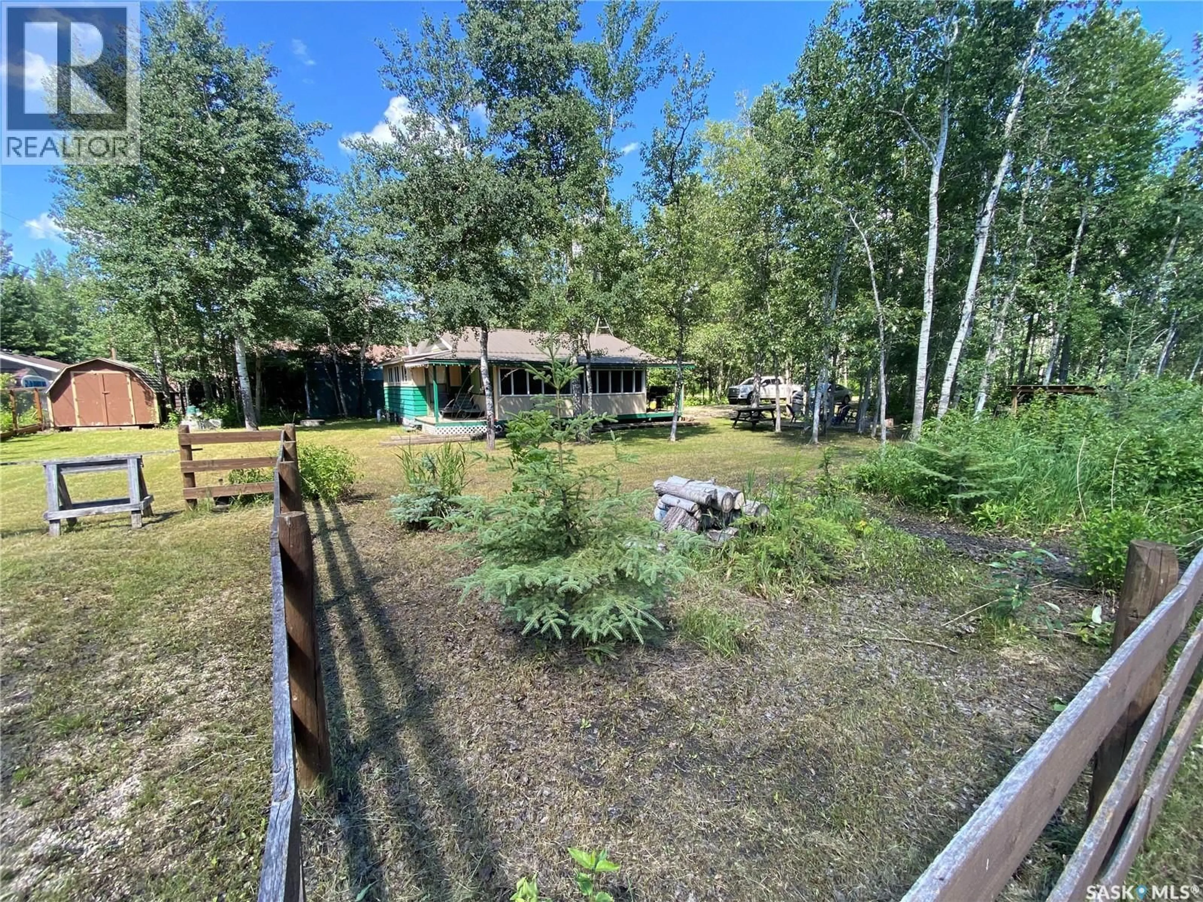 A pic from outside/outdoor area/front of a property/back of a property/a pic from drone, forest/trees view for 114-115 GOVERNMENT ROAD, Good Spirit Lake Saskatchewan S0A0L0