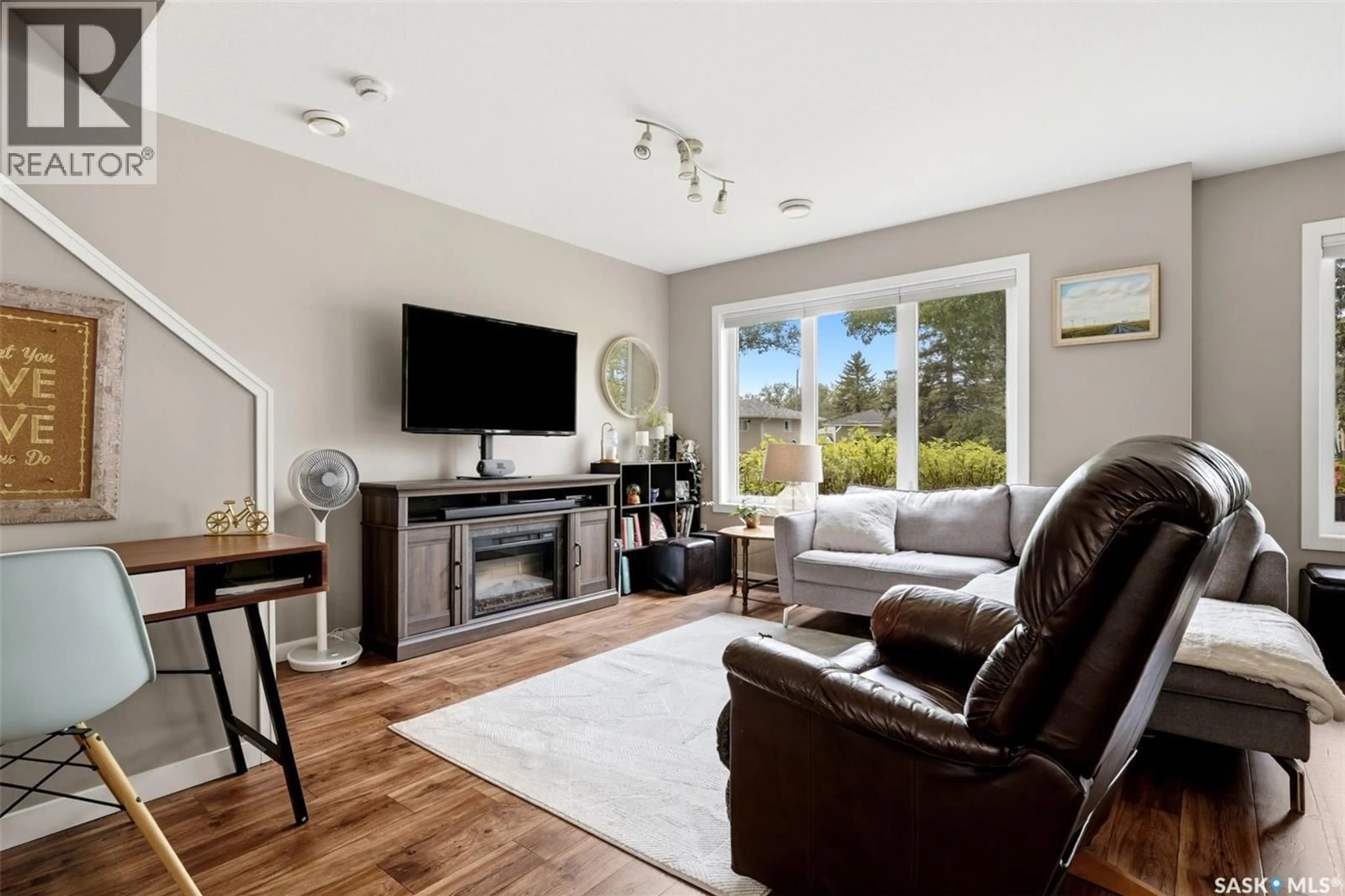 Living room with furniture, wood/laminate floor for 1209 GREY STREET, Regina Saskatchewan S4T1G7
