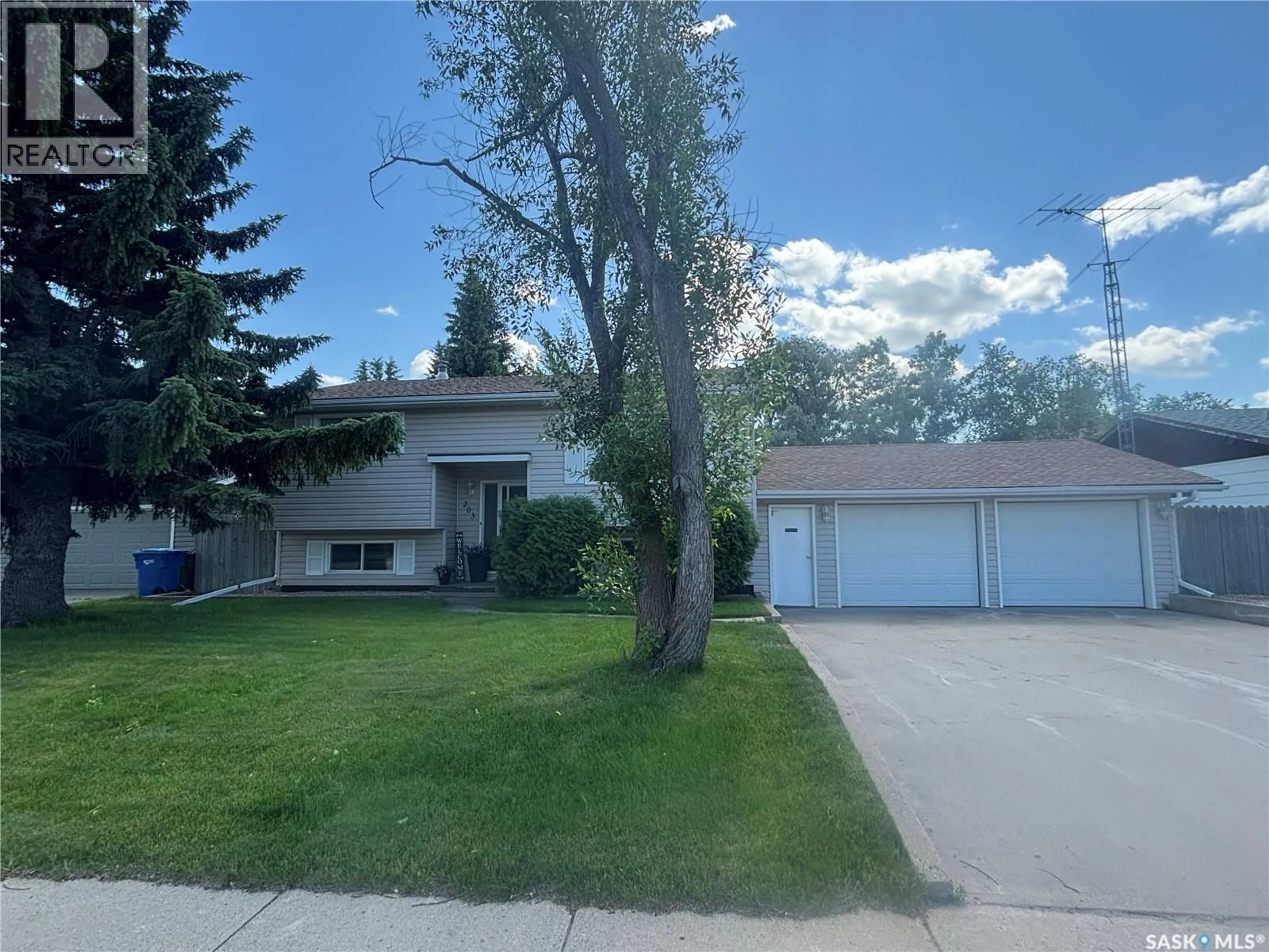 Home with vinyl exterior material, street for 203 CASKEY DRIVE, Melfort Saskatchewan S0E1A0