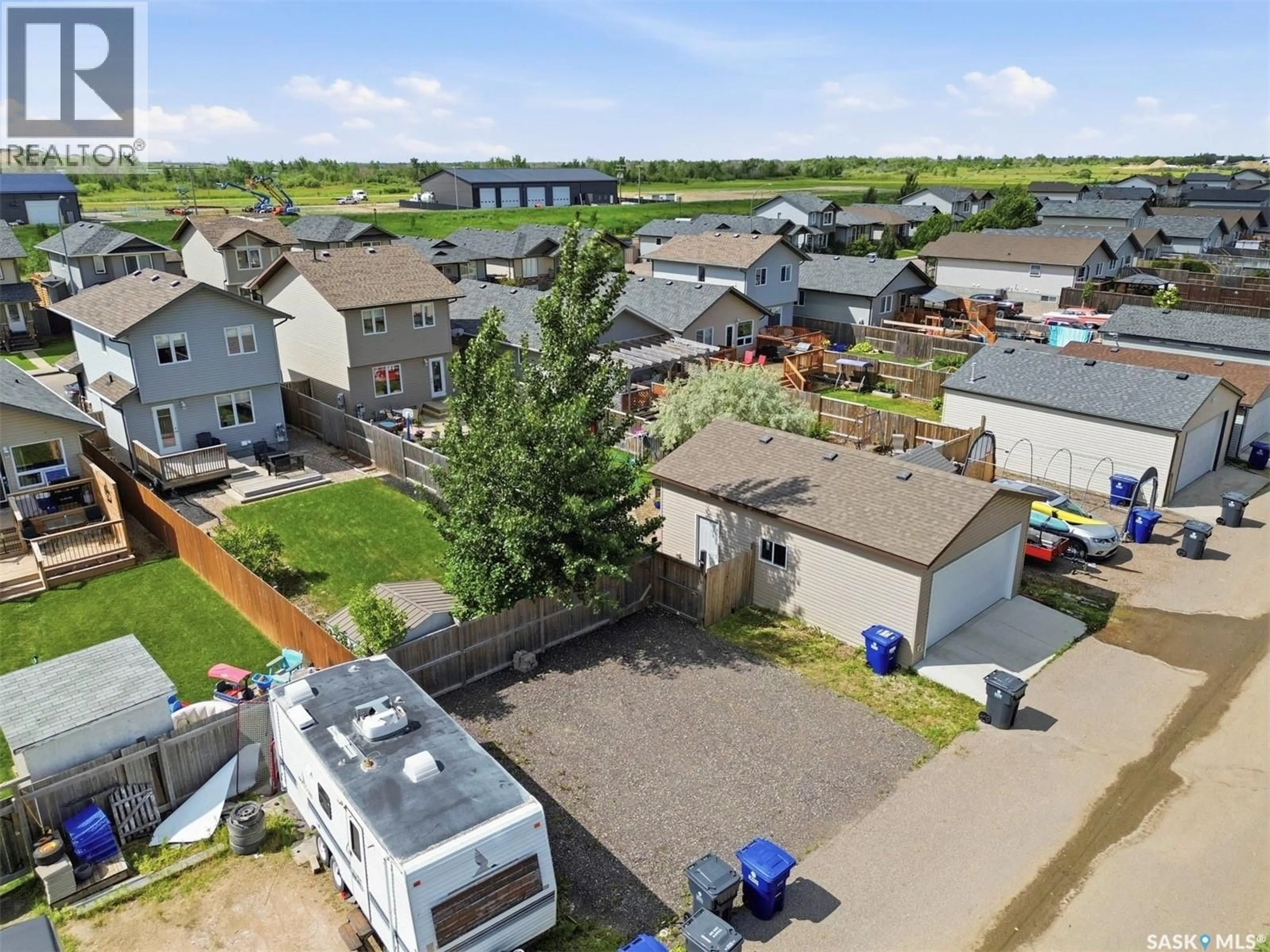 A pic from outside/outdoor area/front of a property/back of a property/a pic from drone, street for 911 GLENVIEW COVE, Martensville Saskatchewan S0K0A2