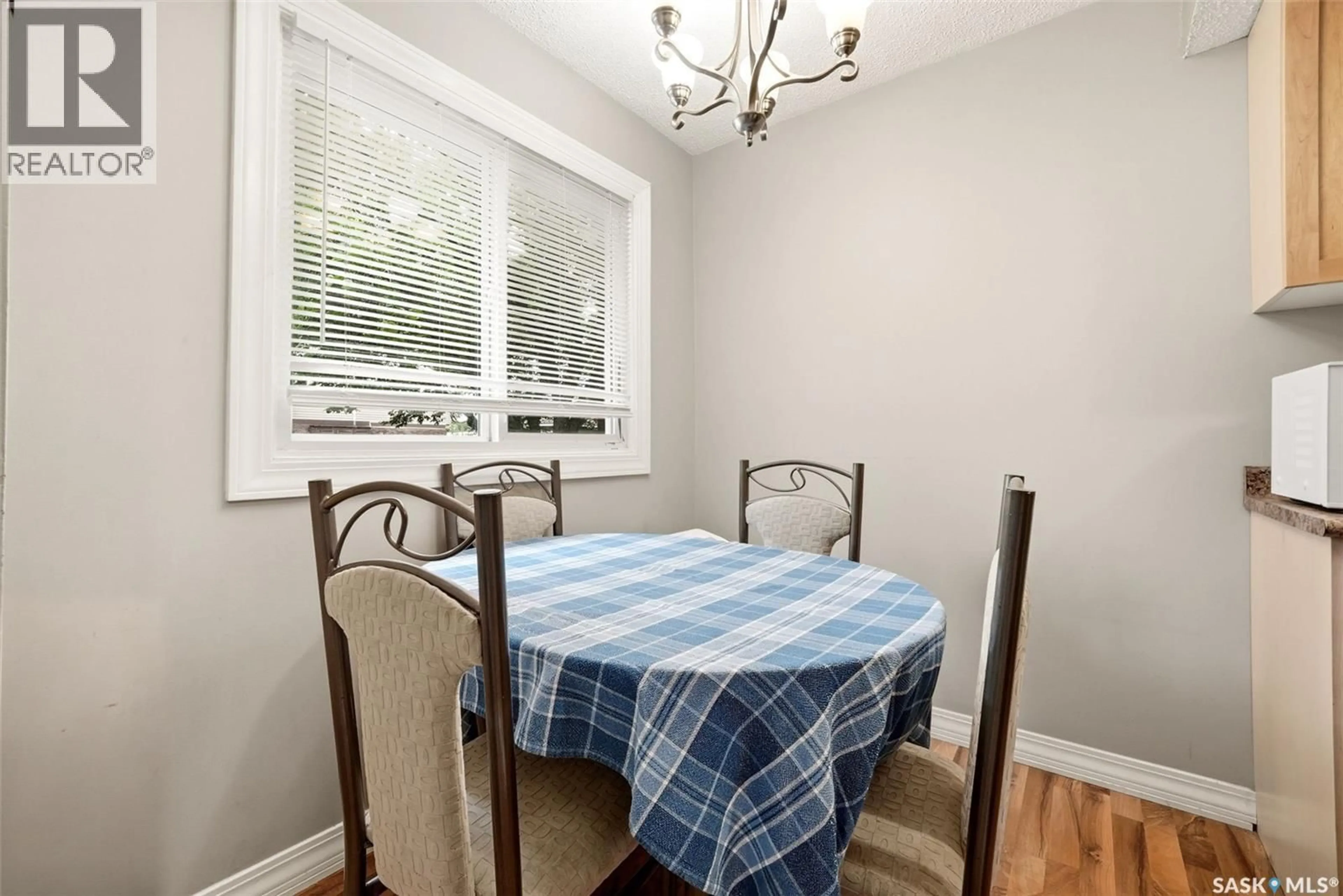 Dining room, wood/laminate floor for 3828 CASTLE ROAD, Regina Saskatchewan S4S6M7