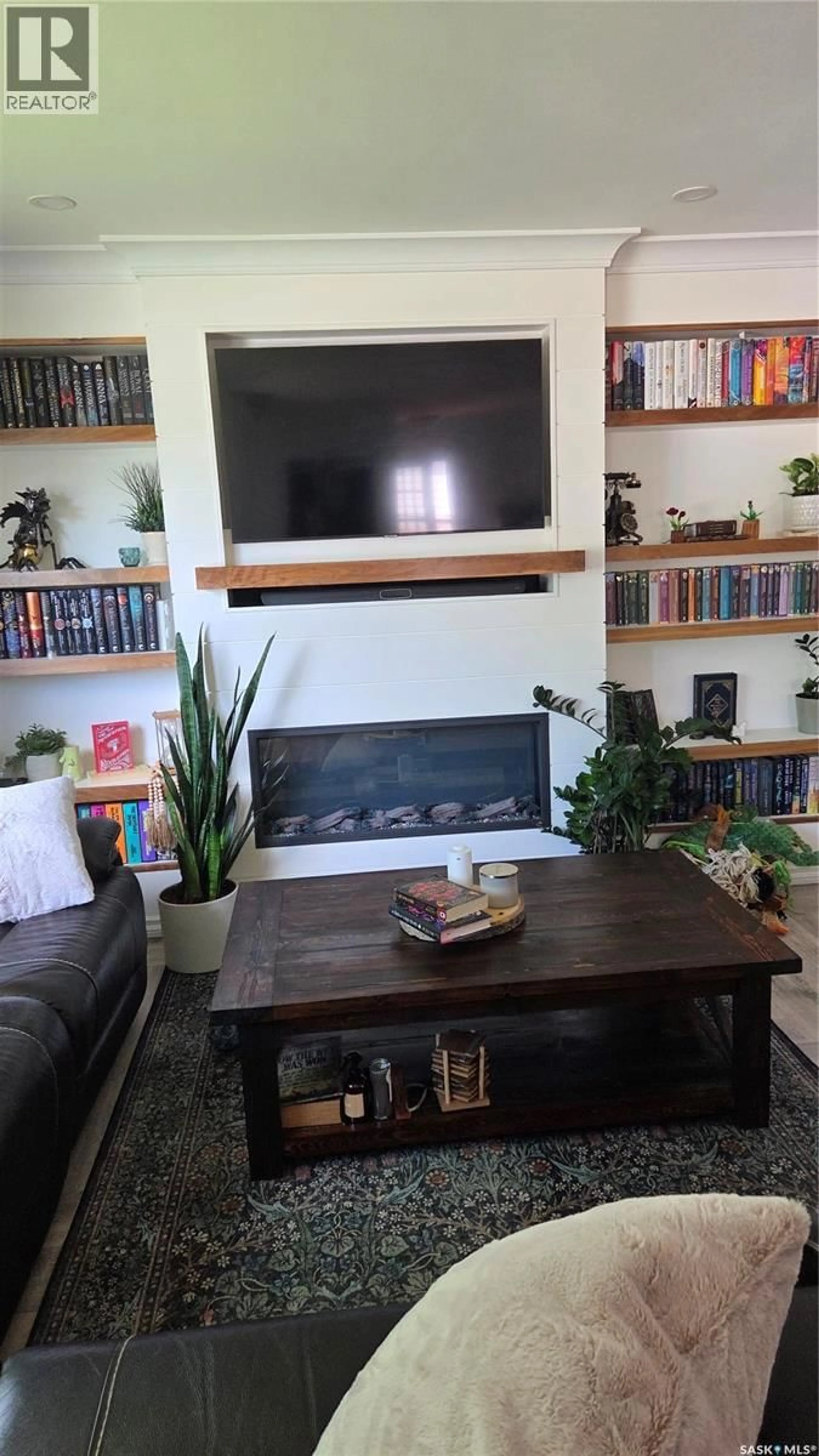 Living room with furniture, wood/laminate floor for 1322 QUEEN CRESCENT, Moose Jaw Saskatchewan S6H3G4