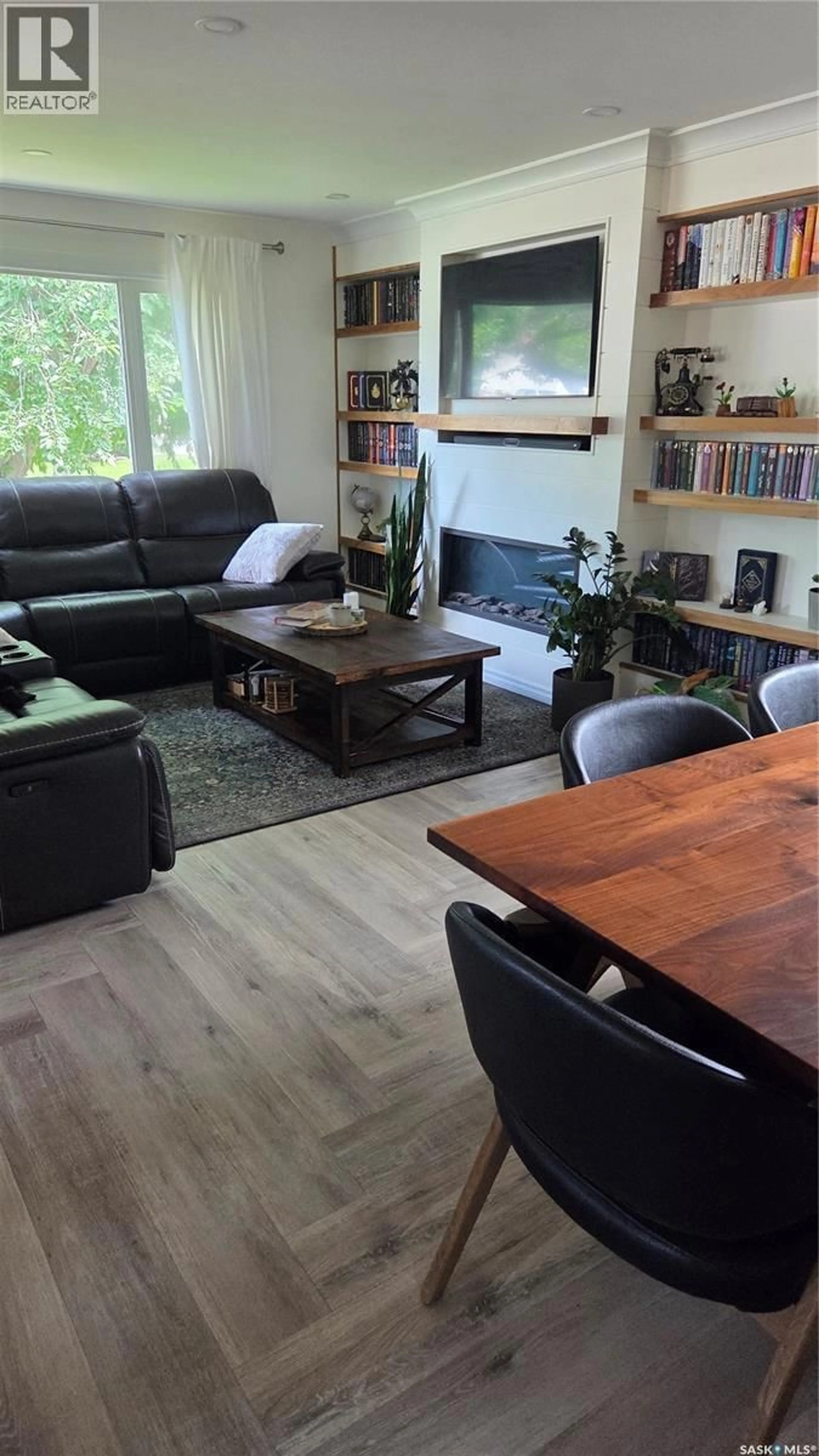 Living room with furniture, wood/laminate floor for 1322 QUEEN CRESCENT, Moose Jaw Saskatchewan S6H3G4