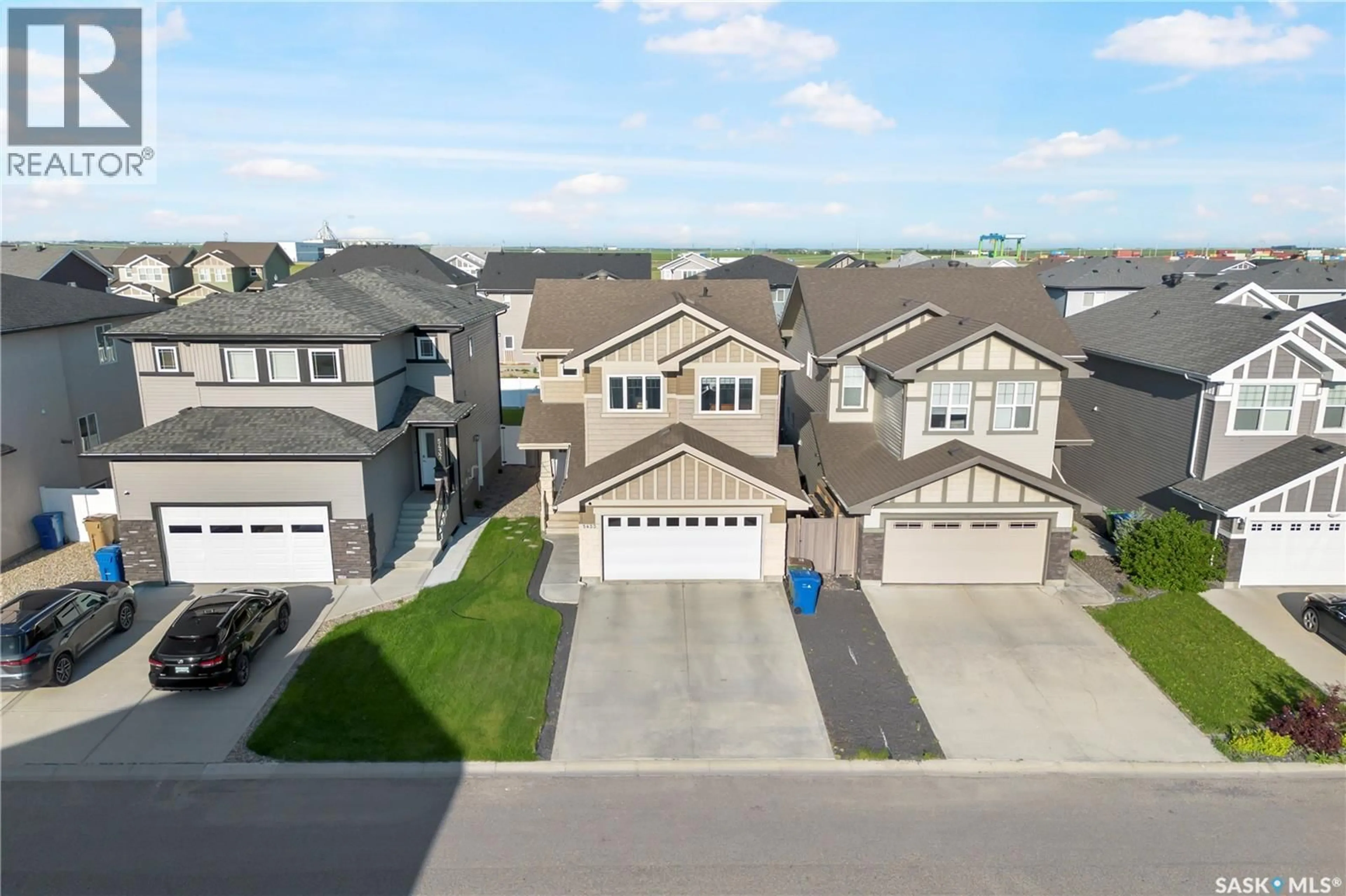 A pic from outside/outdoor area/front of a property/back of a property/a pic from drone, street for E - 5433 GREEN ALDER WAY, Regina Saskatchewan S4V3M7