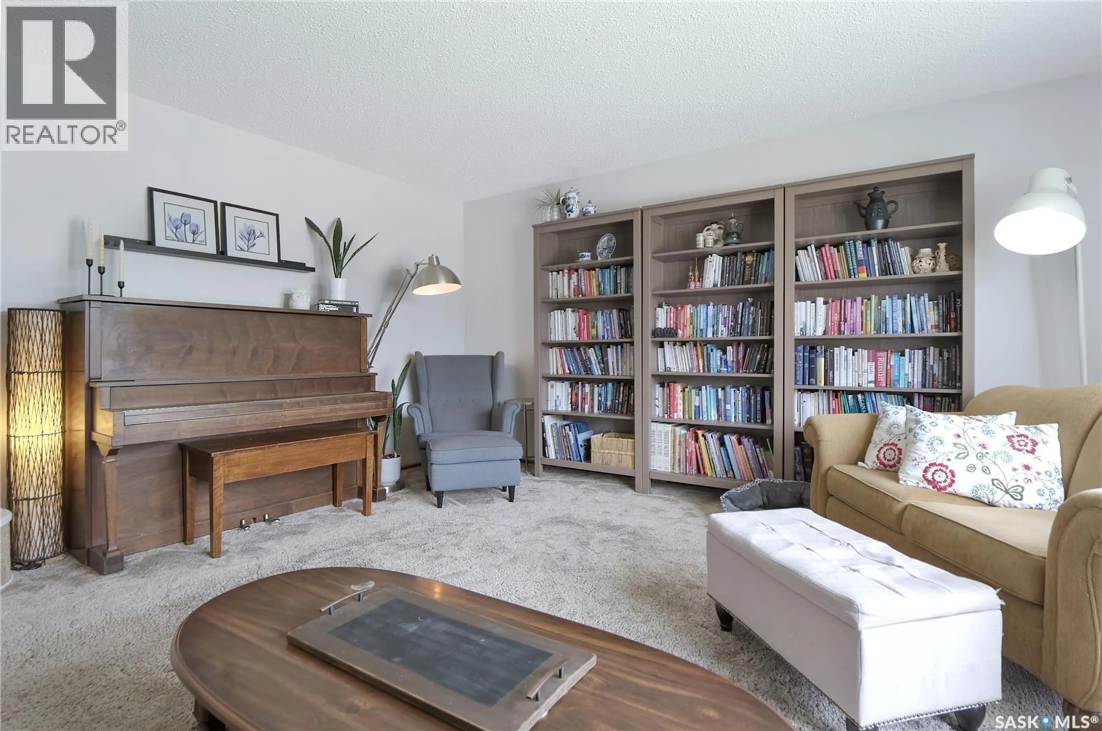 Living room with furniture, wood/laminate floor for 5 SHAW PLACE, Assiniboia Saskatchewan S0H0B0
