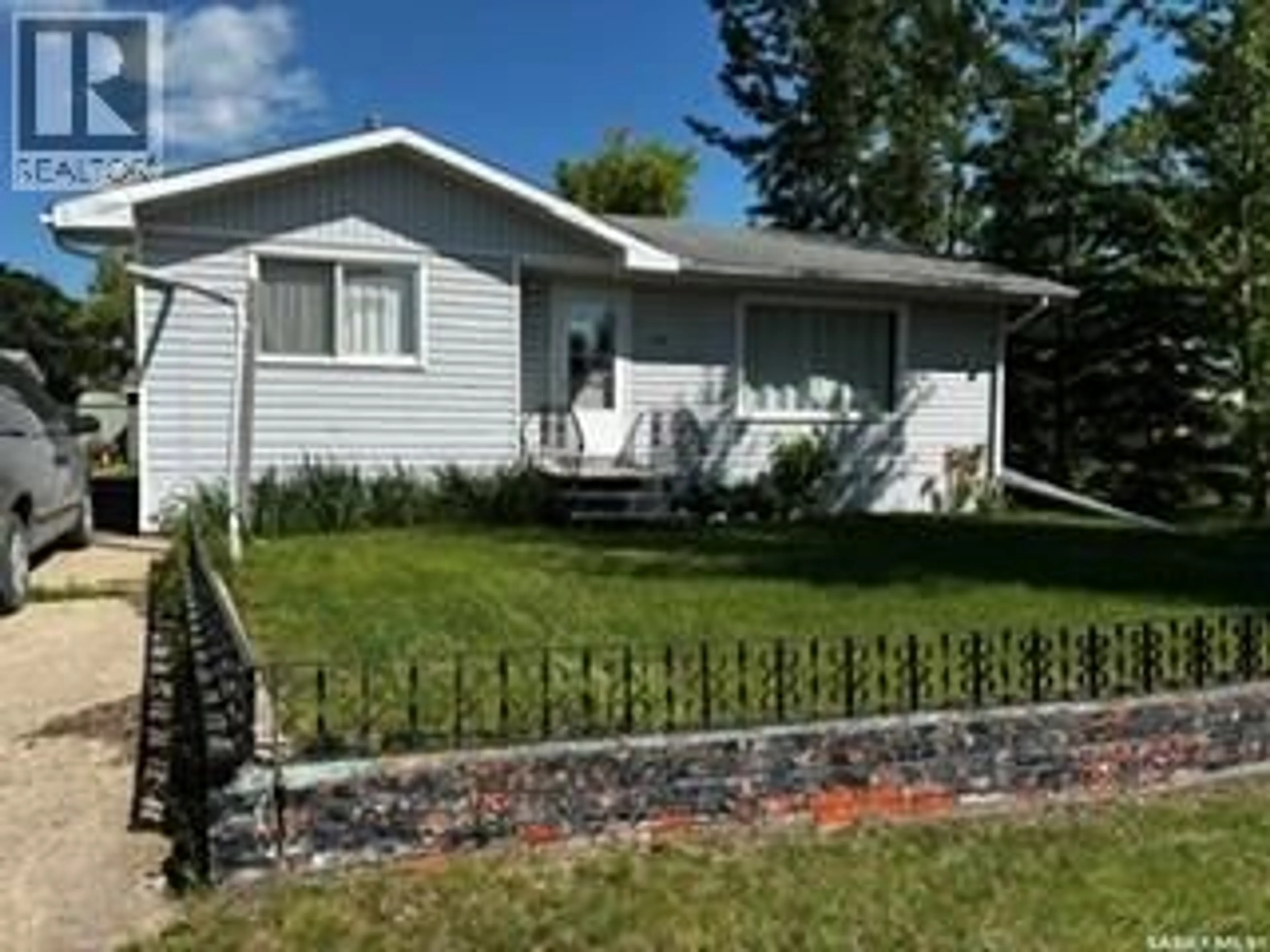 Home with vinyl exterior material, street for 1104 97TH STREET, Tisdale Saskatchewan S0E1T0