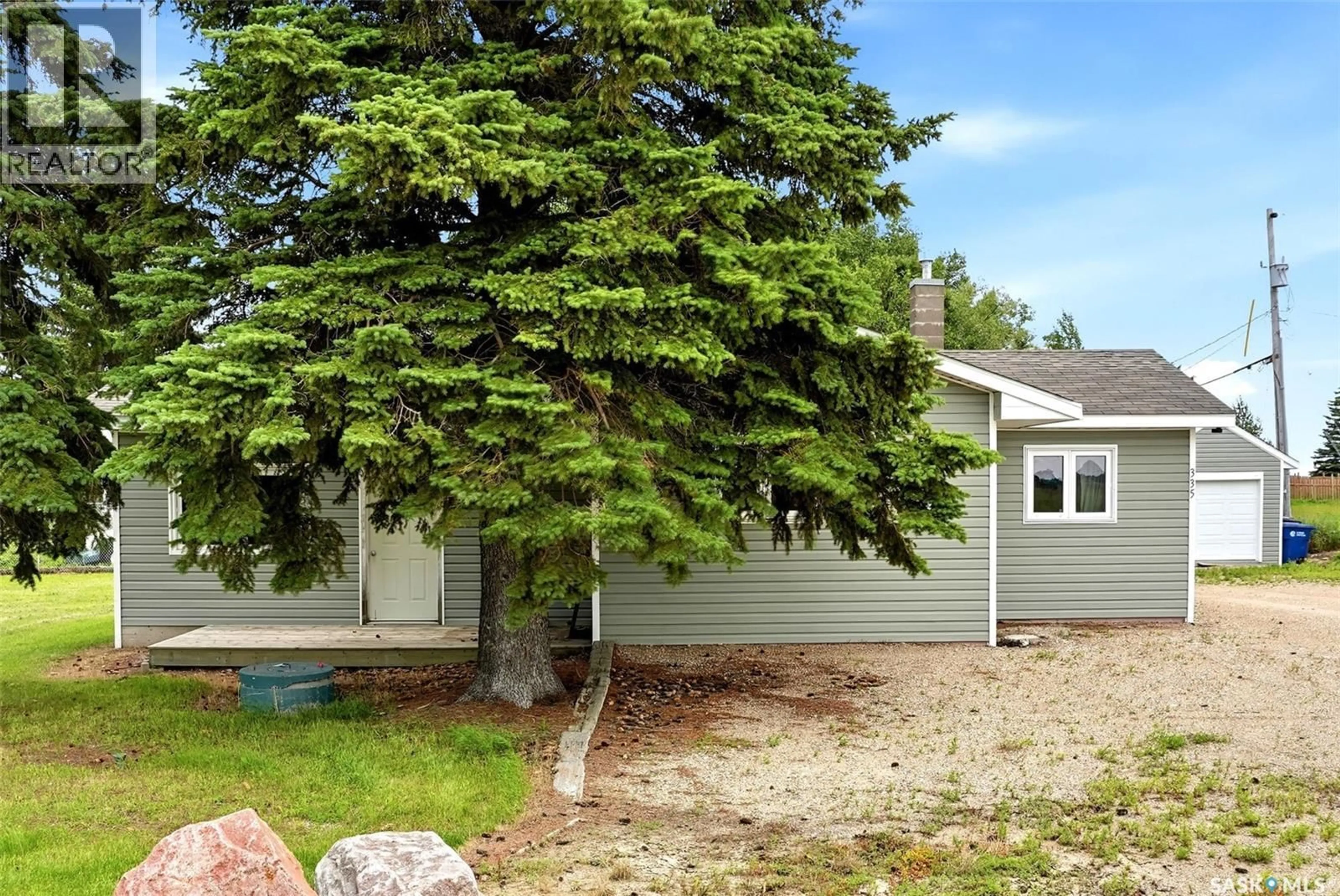 Home with vinyl exterior material, street for 335 BETA STREET, Mclean Saskatchewan S0G3E0