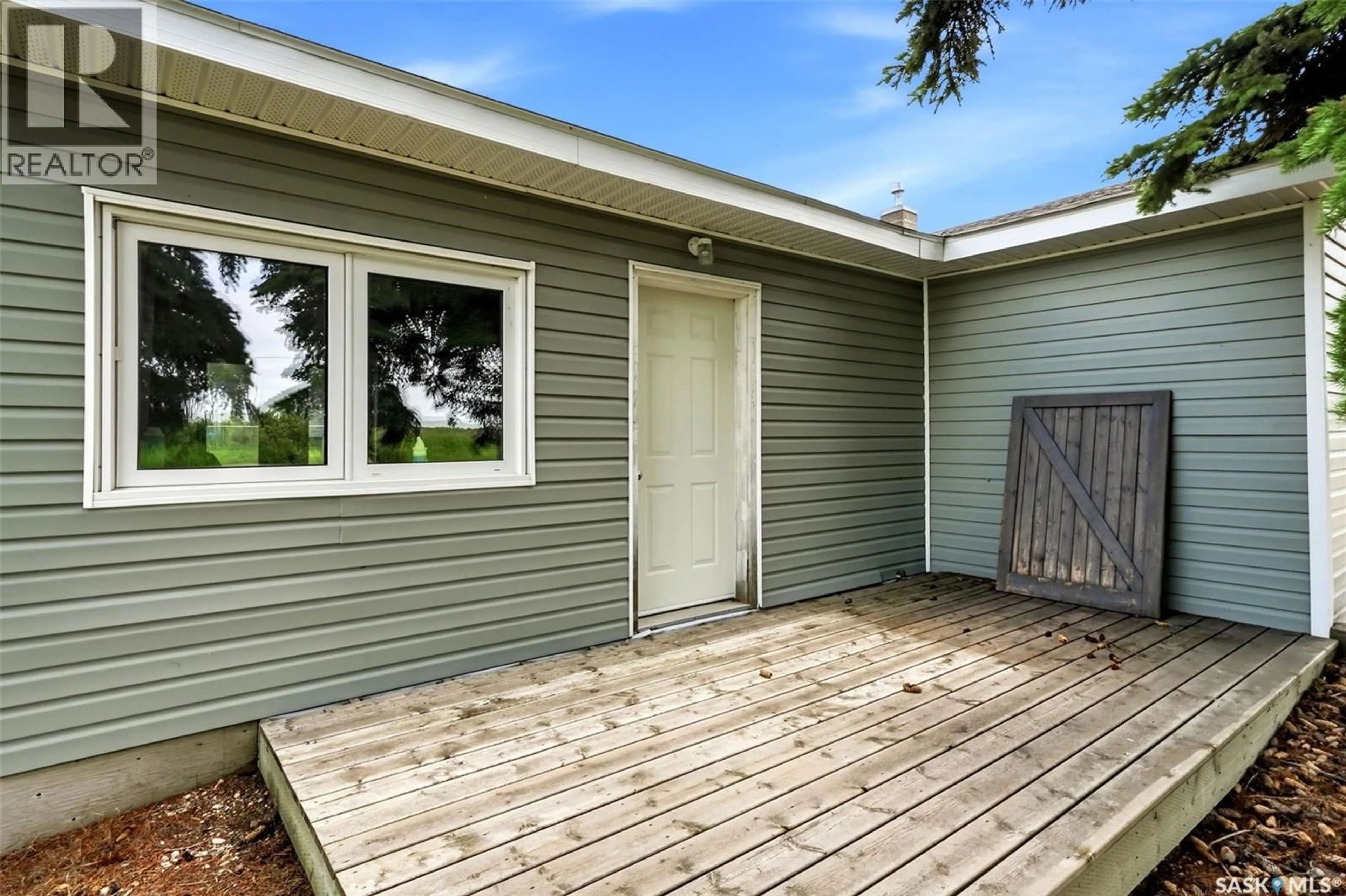 Home with vinyl exterior material, street for 335 BETA STREET, Mclean Saskatchewan S0G3E0