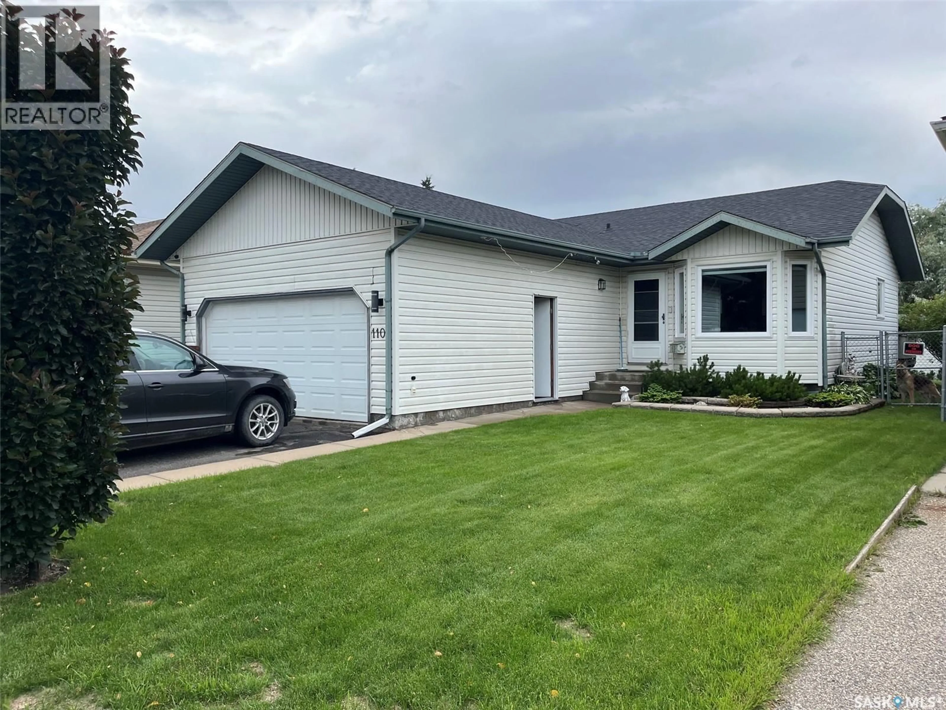Home with vinyl exterior material, street for 110 26TH STREET, Prince Albert Saskatchewan S6V1Z7
