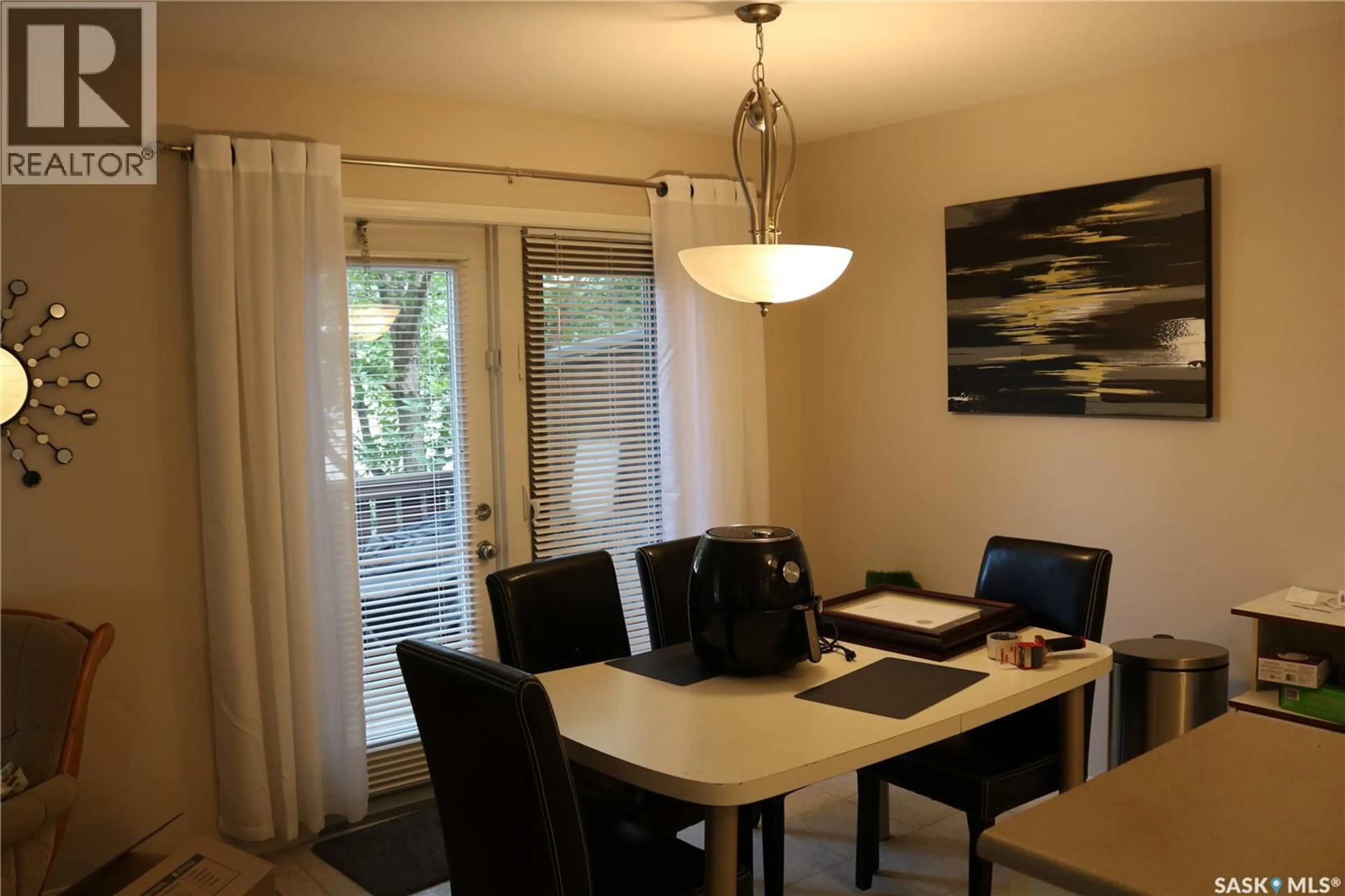 Dining room, wood/laminate floor for 405 - 127 BAYFIELD CRESCENT, Saskatoon Saskatchewan S7V1J4