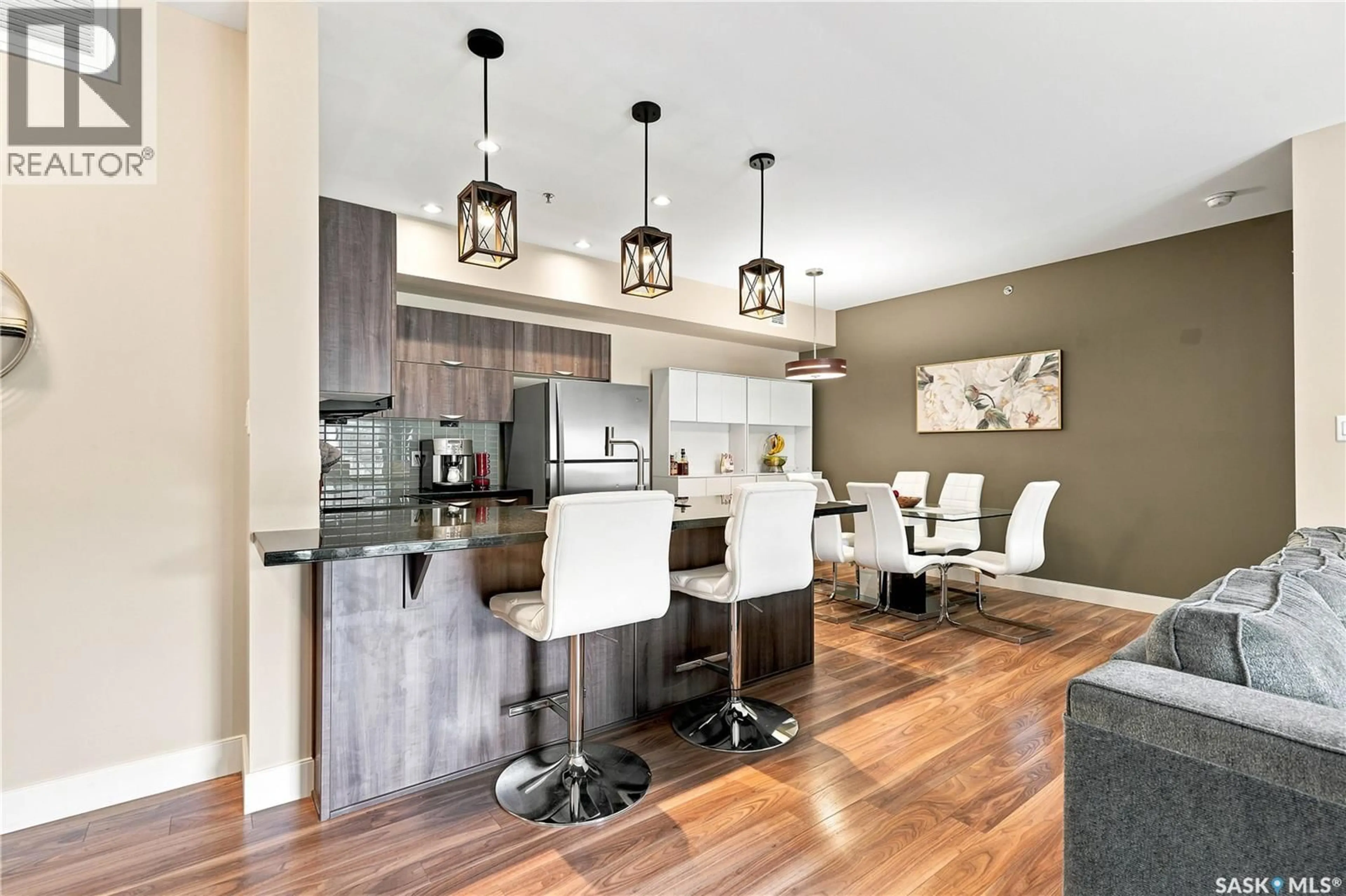 Open concept kitchen, wood/laminate floor for 203 - 721 8TH STREET, Saskatoon Saskatchewan S7H0R4