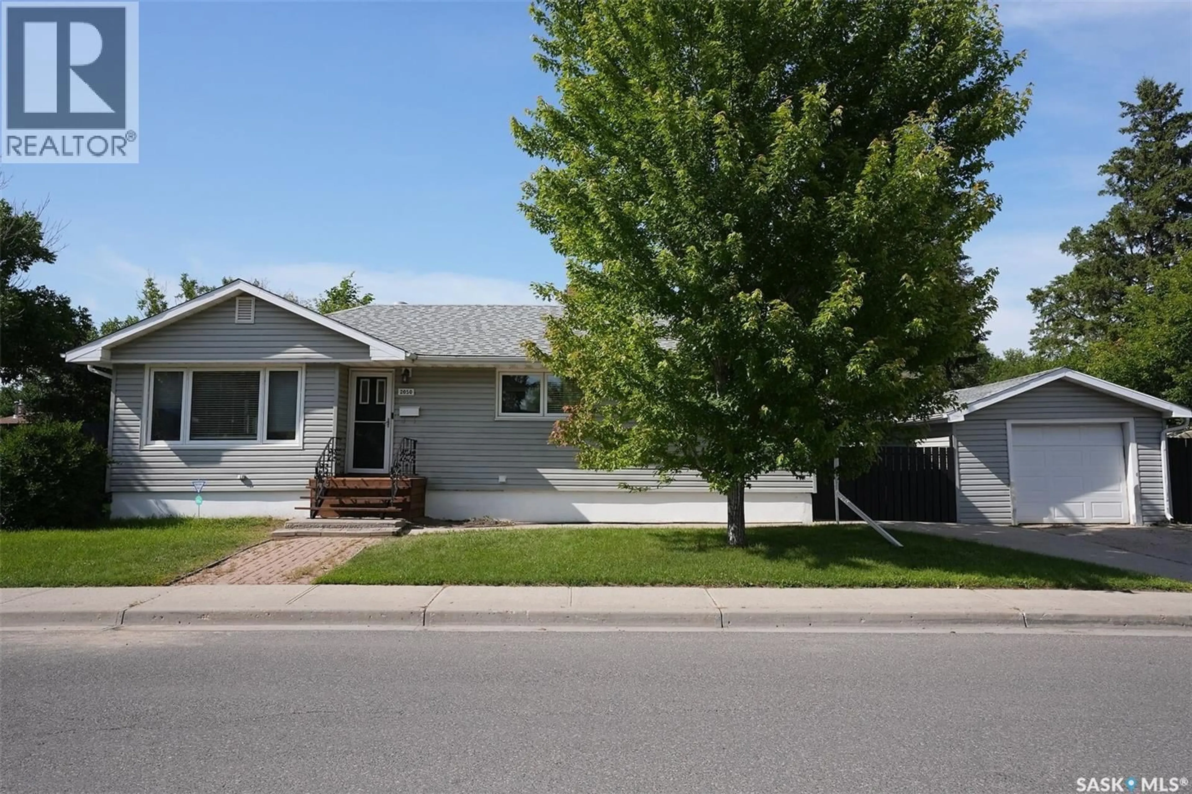 Home with vinyl exterior material, street for 2050 JUBILEE AVENUE, Regina Saskatchewan S4S3T8