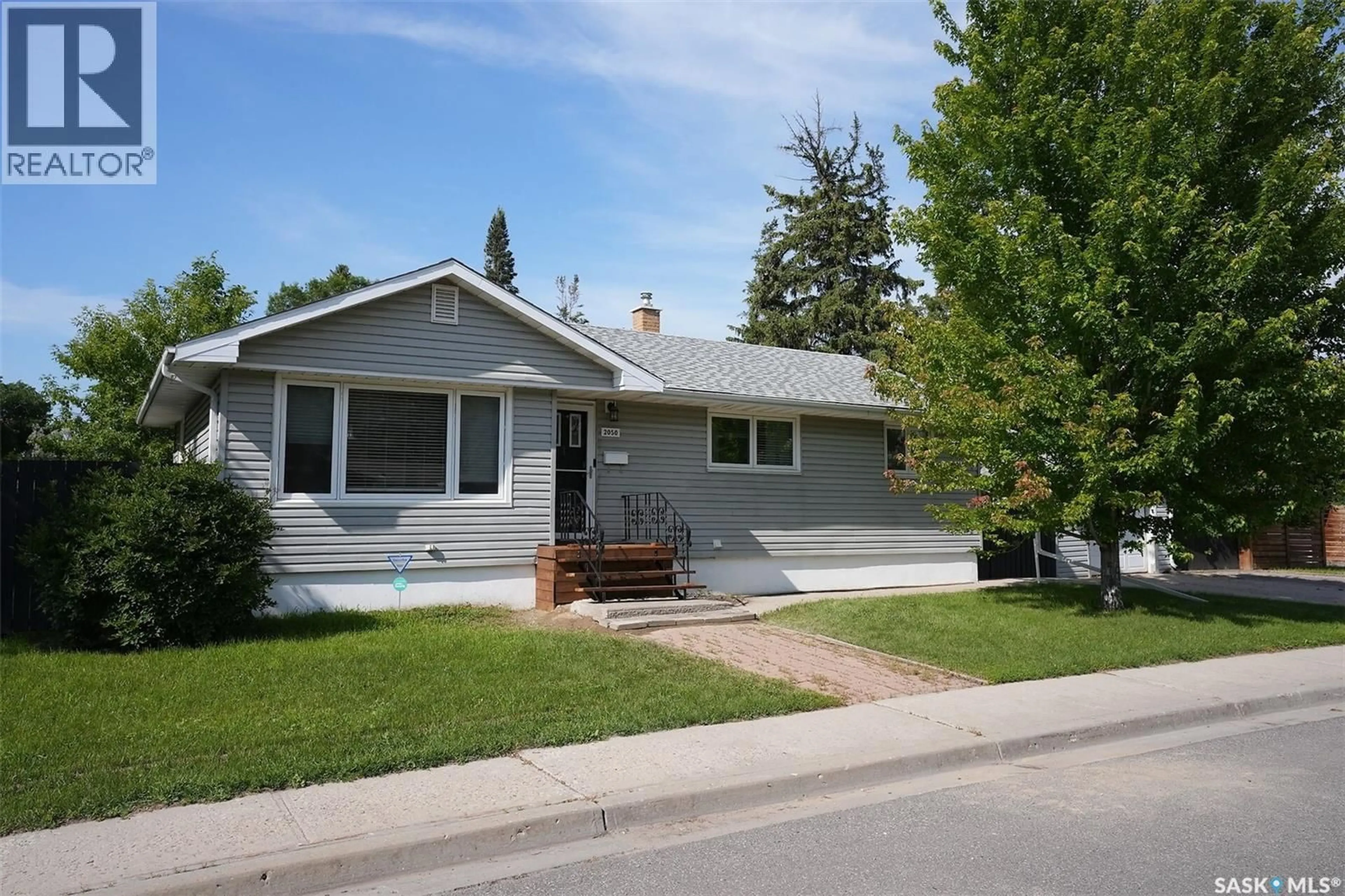 Home with vinyl exterior material, street for 2050 JUBILEE AVENUE, Regina Saskatchewan S4S3T8