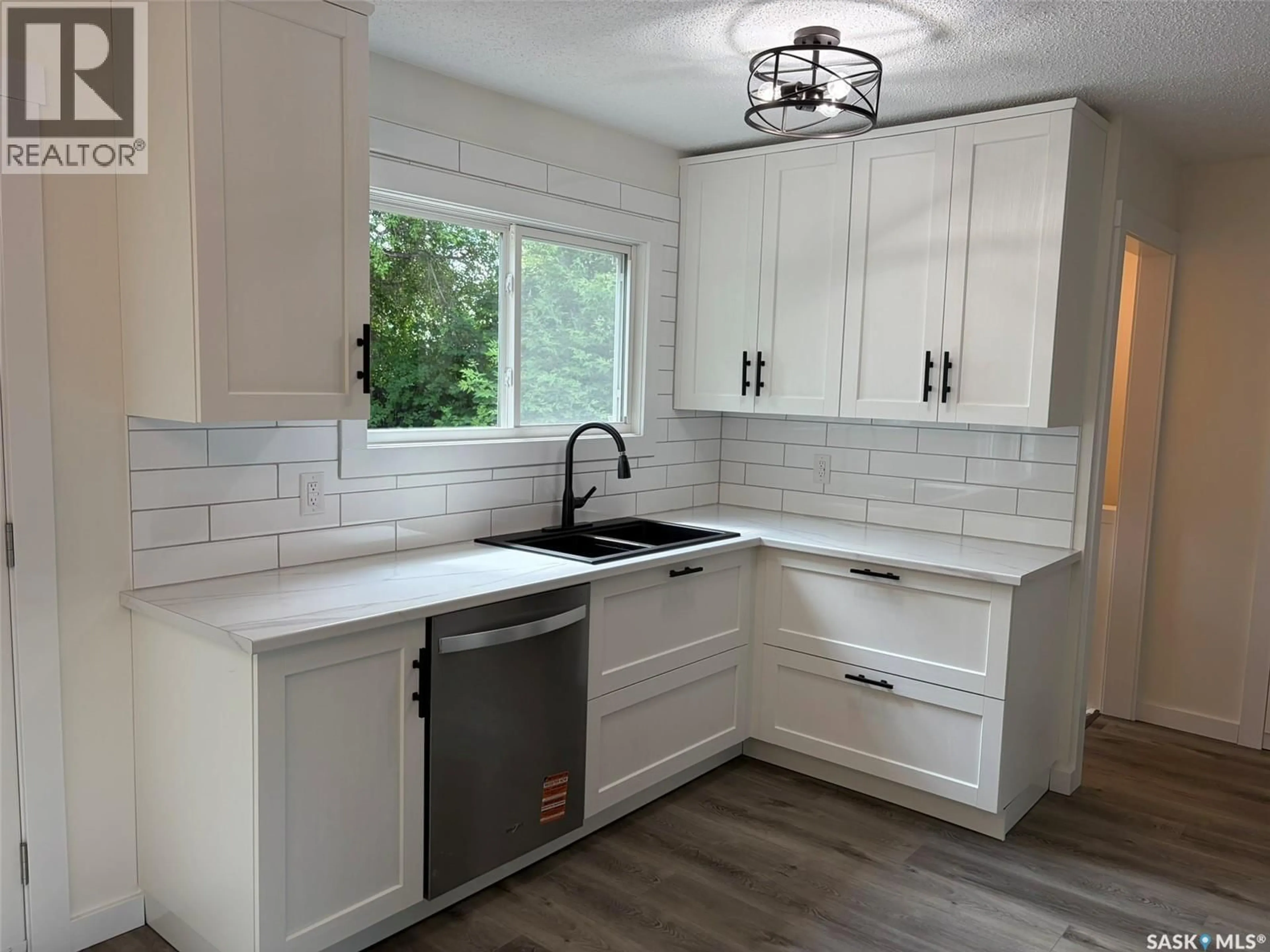 Open concept kitchen, ceramic/tile floor for 565 32ND STREET, Prince Albert Saskatchewan S6V6B7