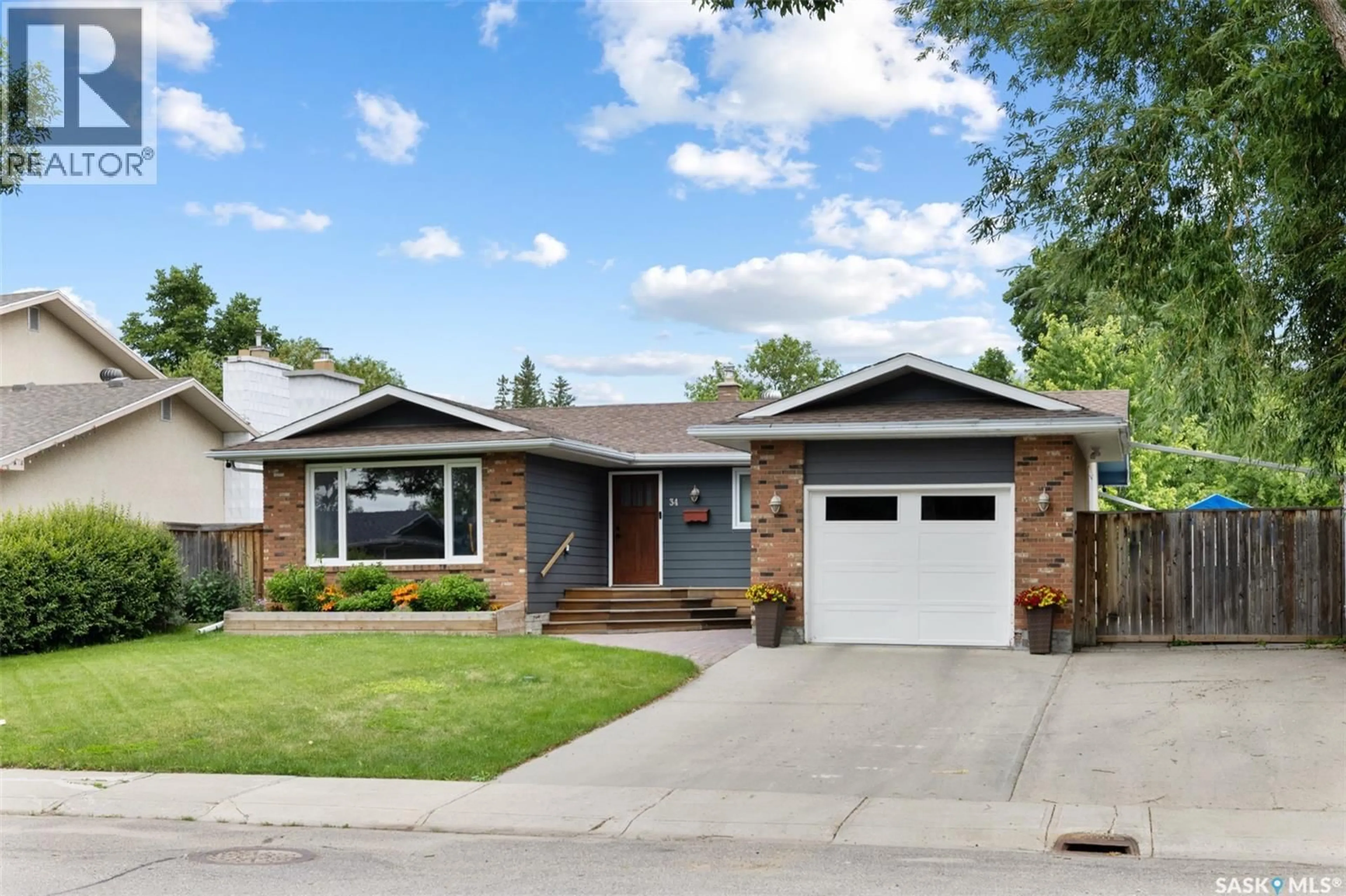 Home with brick exterior material, street for 34 PLAINSVIEW DRIVE, Regina Saskatchewan S4S6K3