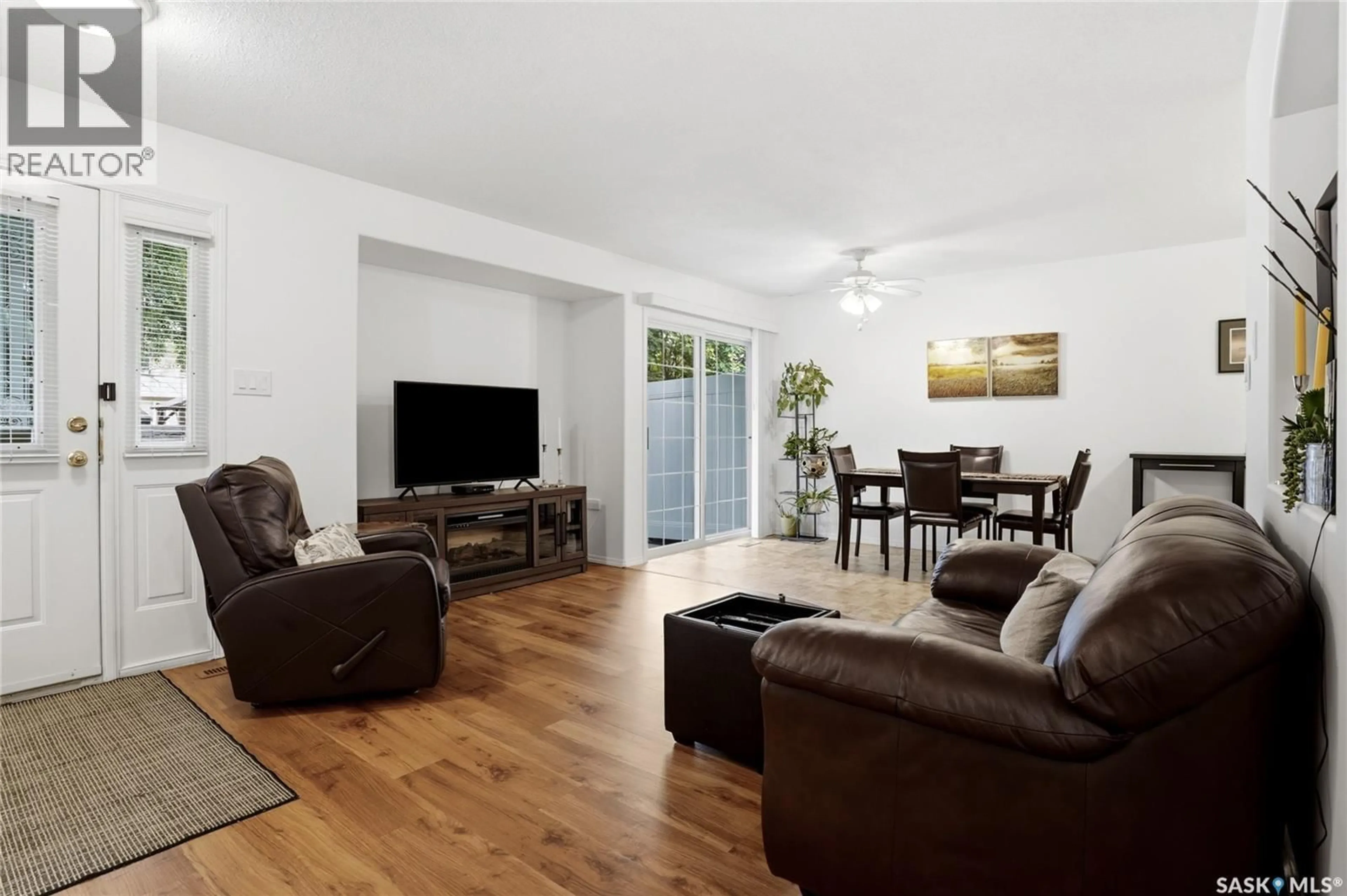 Living room with furniture, wood/laminate floor for 5464 ROCHDALE BOULEVARD, Regina Saskatchewan S4X4P1