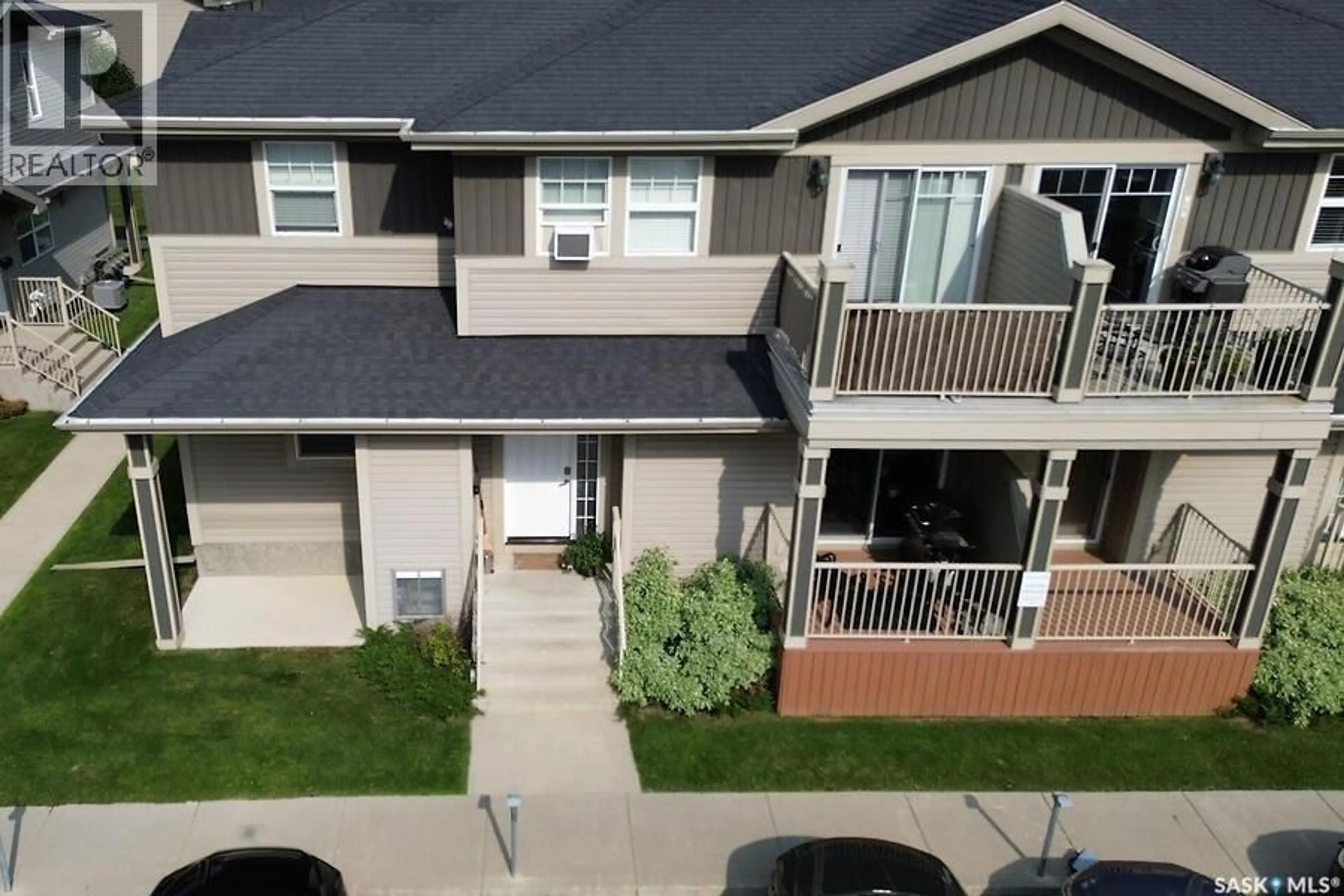 A pic from outside/outdoor area/front of a property/back of a property/a pic from drone, street for 202 100 CHAPARRAL BOULEVARD, Martensville Saskatchewan S0K0A2