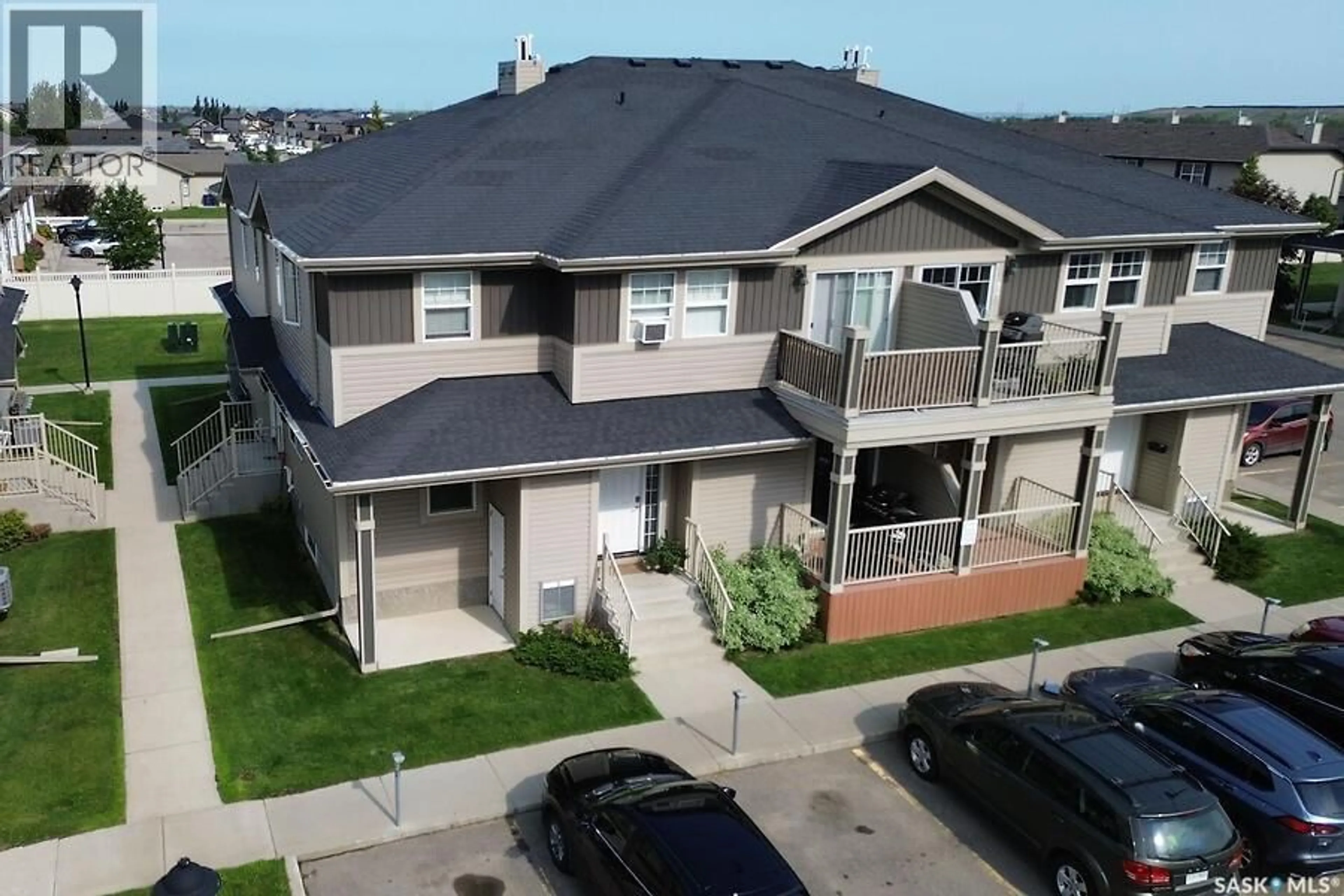 A pic from outside/outdoor area/front of a property/back of a property/a pic from drone, street for 202 100 CHAPARRAL BOULEVARD, Martensville Saskatchewan S0K0A2