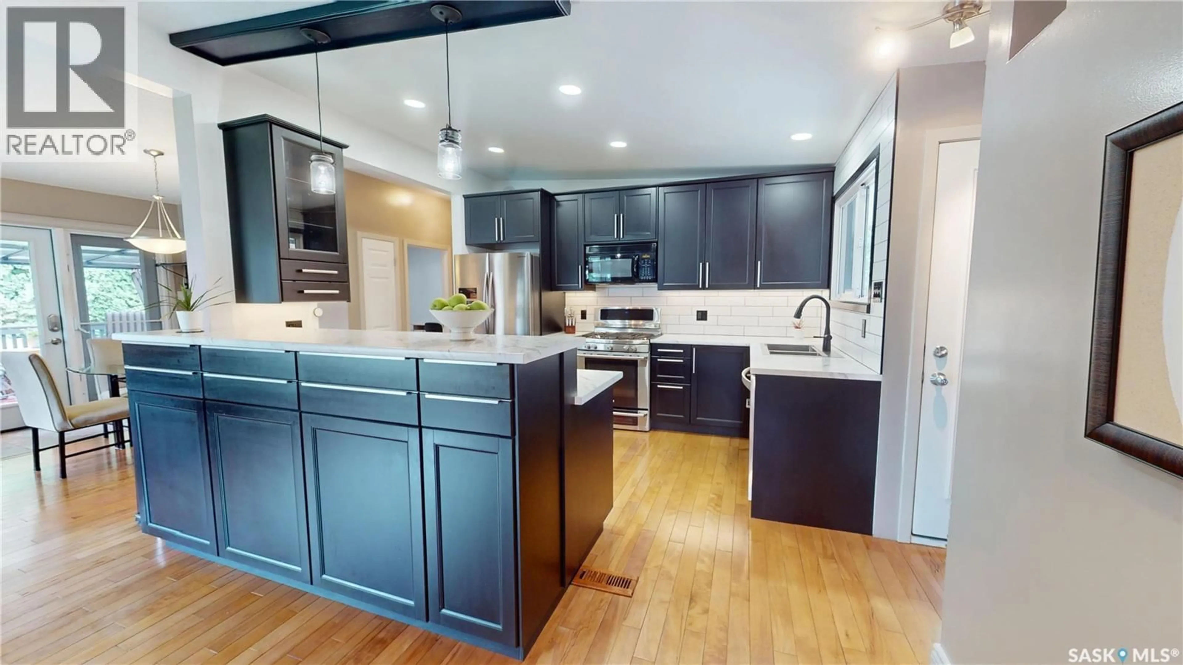 Open concept kitchen, wood/laminate floor for 1801 WILSON CRESCENT, Saskatoon Saskatchewan S7J2N8